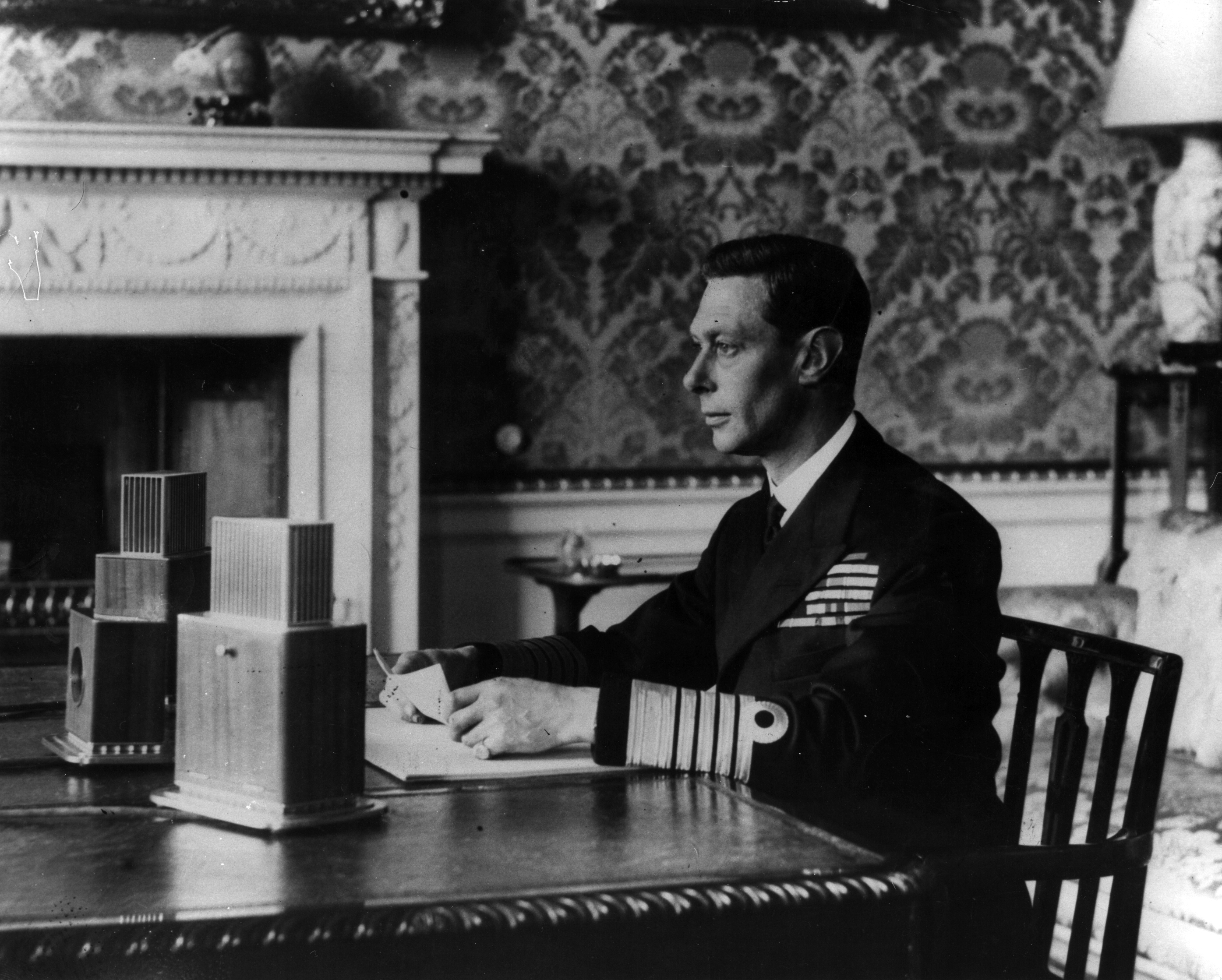 King George VI addressing the nation live over BBC news radio networks on September 3, 1939 | Source: Getty Images