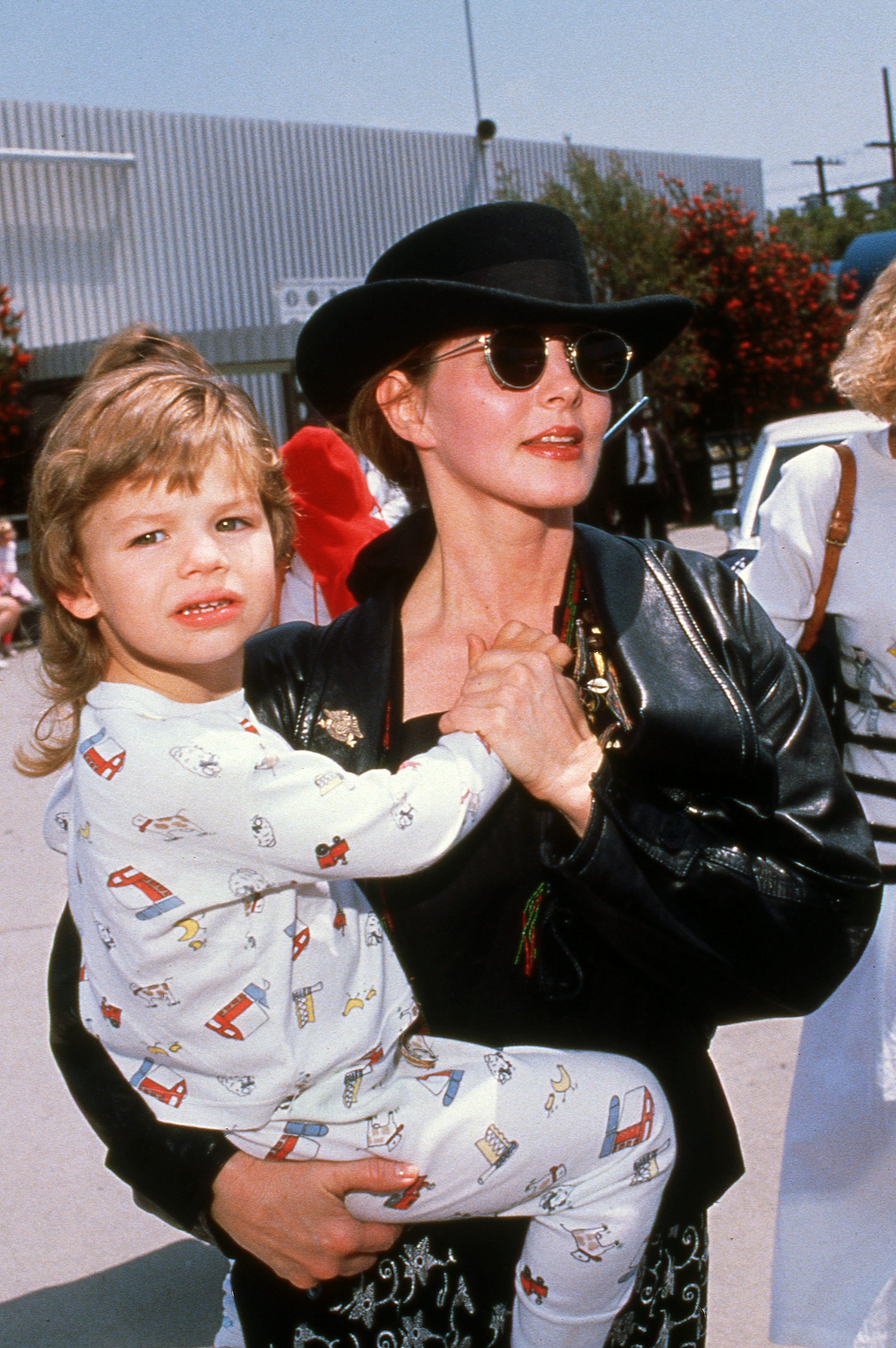 Priscilla Presley and Navarone Garibaldi, 1990 | Source: Getty Images