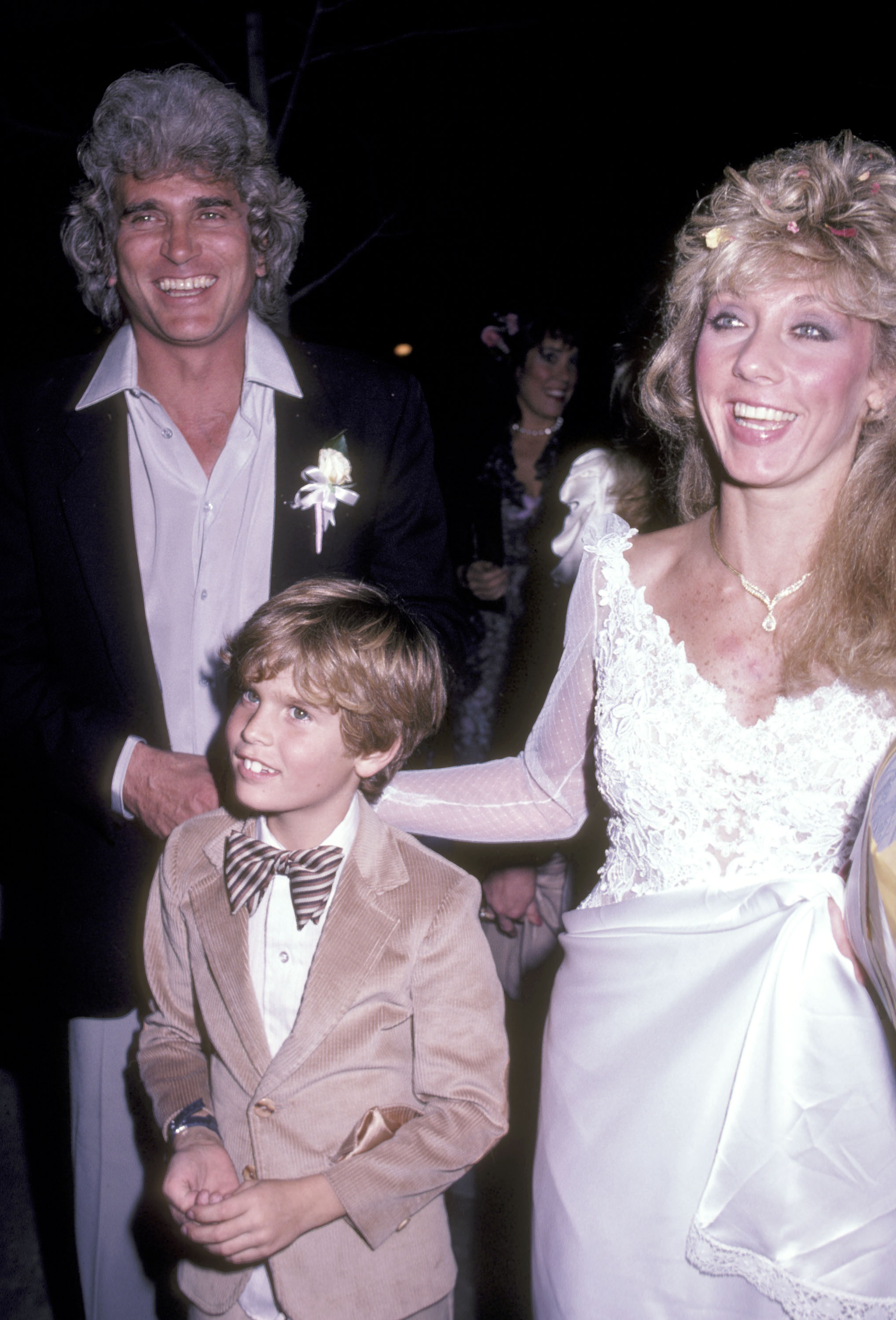 Actor Michael Landon, his then-new bride Cindy Landon and his son Christopher Landon at their wedding reception on February 14, 1983, at La Scala Restaurant in Beverly Hills, California. | Source: Getty Images