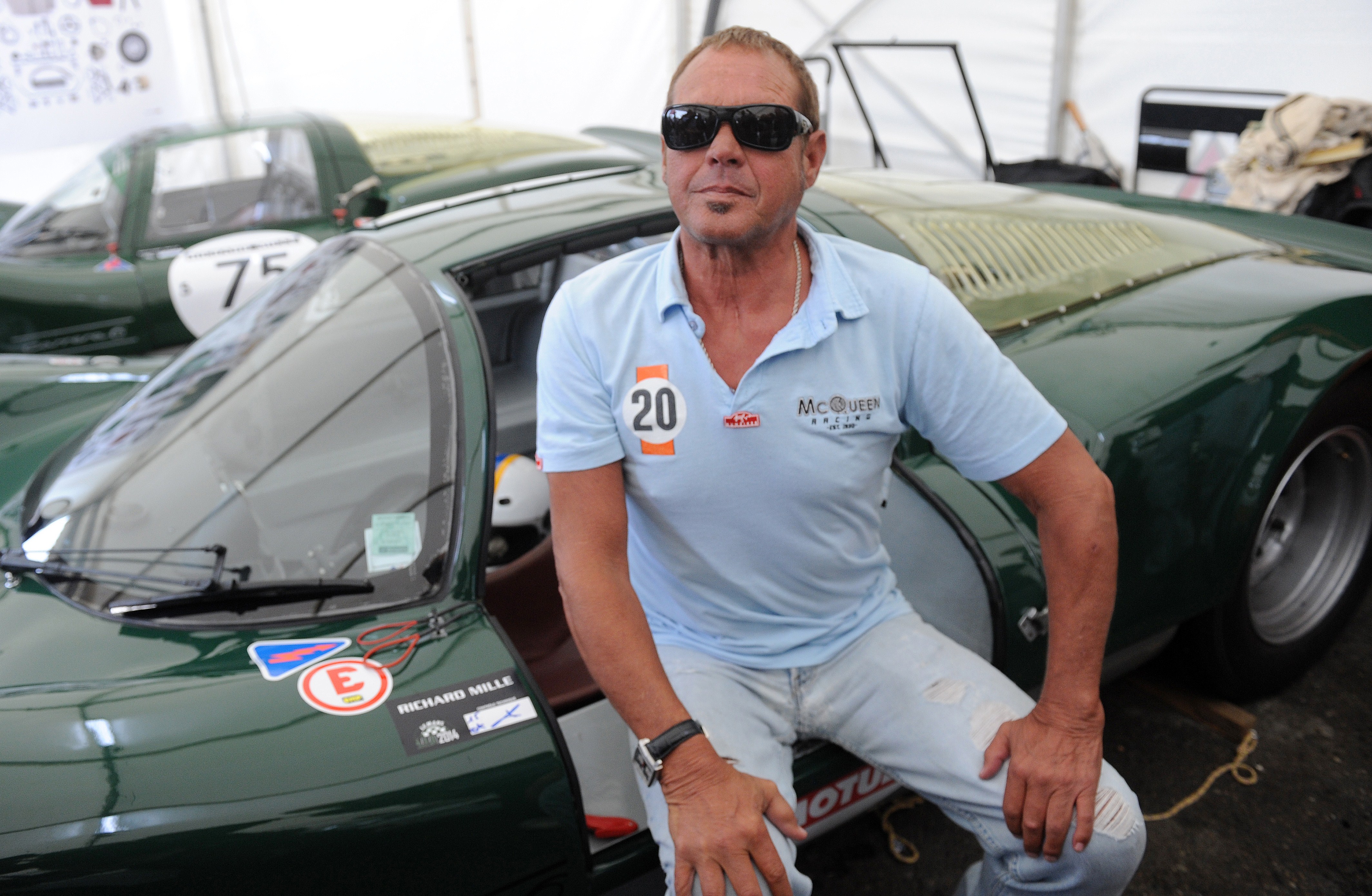 Chad McQueen poses while sitting on a 1966 Porsche 906 on July 6, 2014 | Source: Getty Images