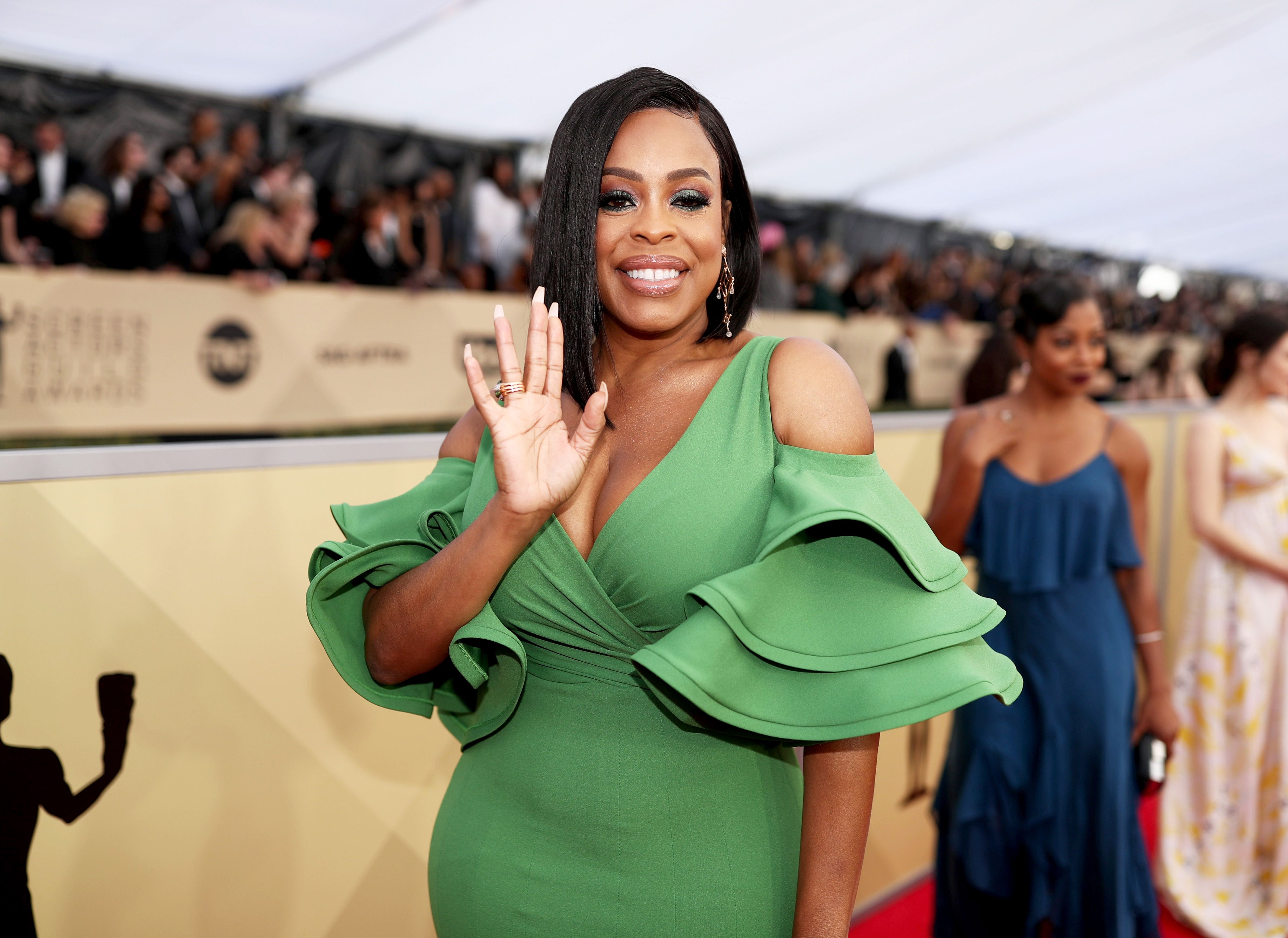 Niecy Nash Already Standing up as She Poses in Tight Dress after