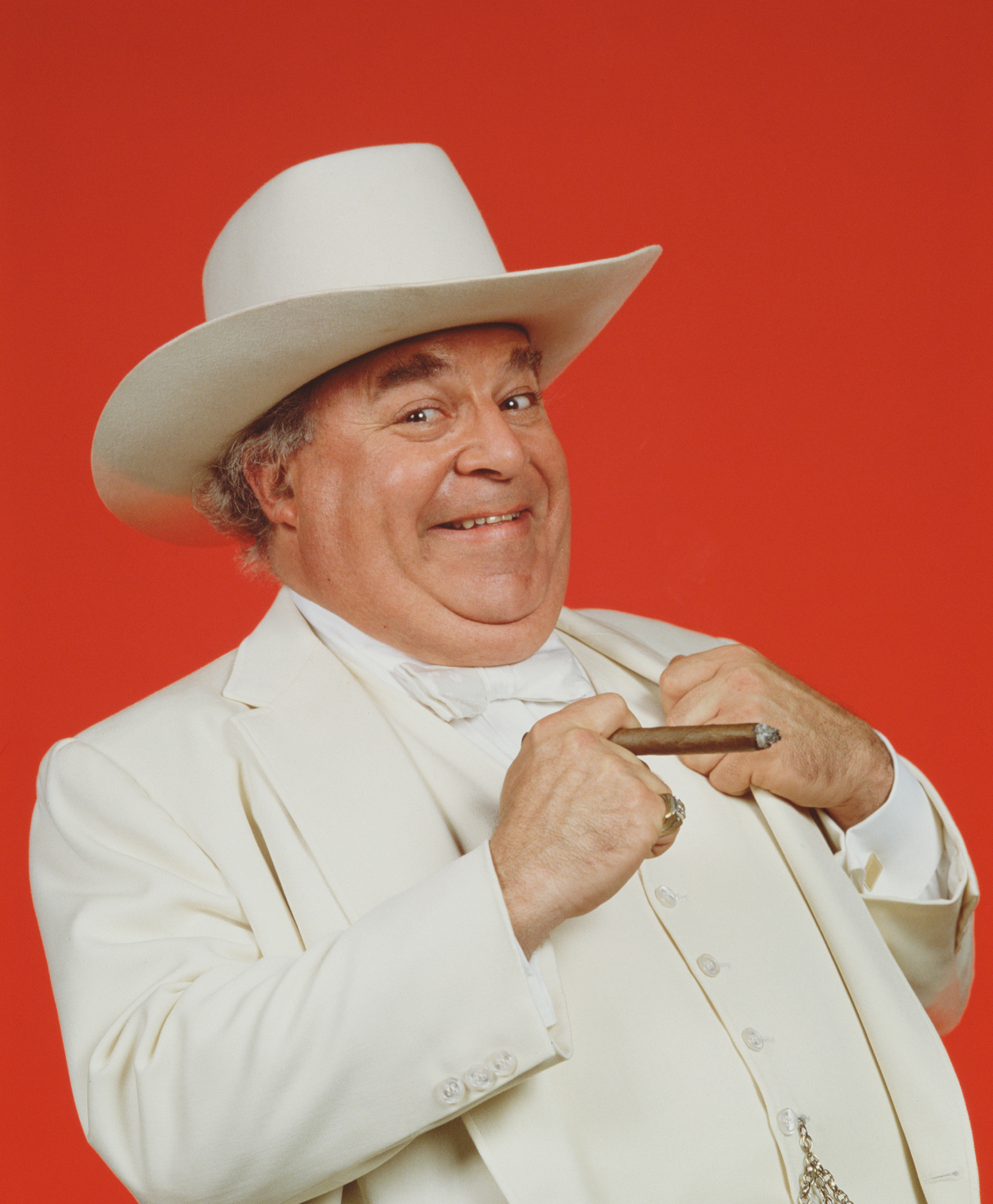 Booke's white suit, oversized cowboy hat, and cigar became key parts of Boss Hogg's visual identity. This 1982 portrait captures the exaggerated look that helped make the character instantly recognizable.  | Source: Getty Images