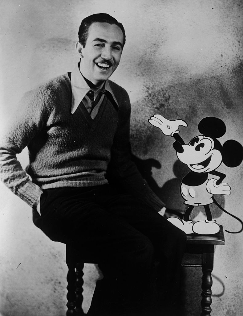 American animator and producer Walt Disney with one of his creations Mickey Mouse | Getty Images