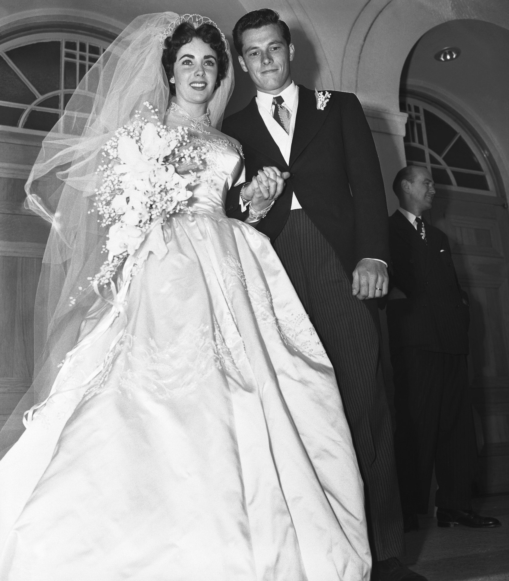 Newlyweds Elizabeth Taylor and Conrad Hilton Jr., pictured at the Church of the Good Shepherd after their nuptials in 1950. / Source: Getty Images