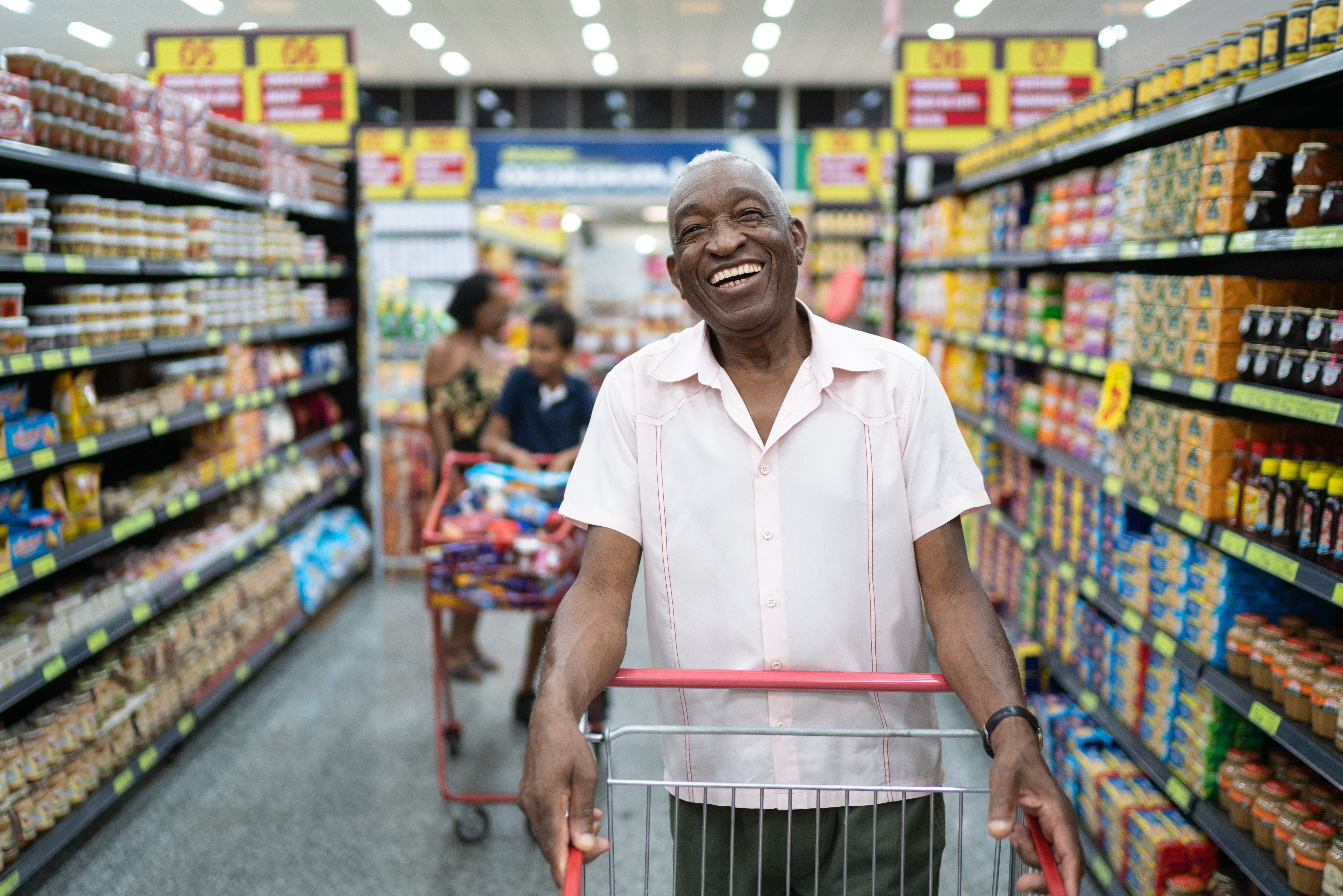 Afro senior at the supermarket portrait | Source: Getty Images