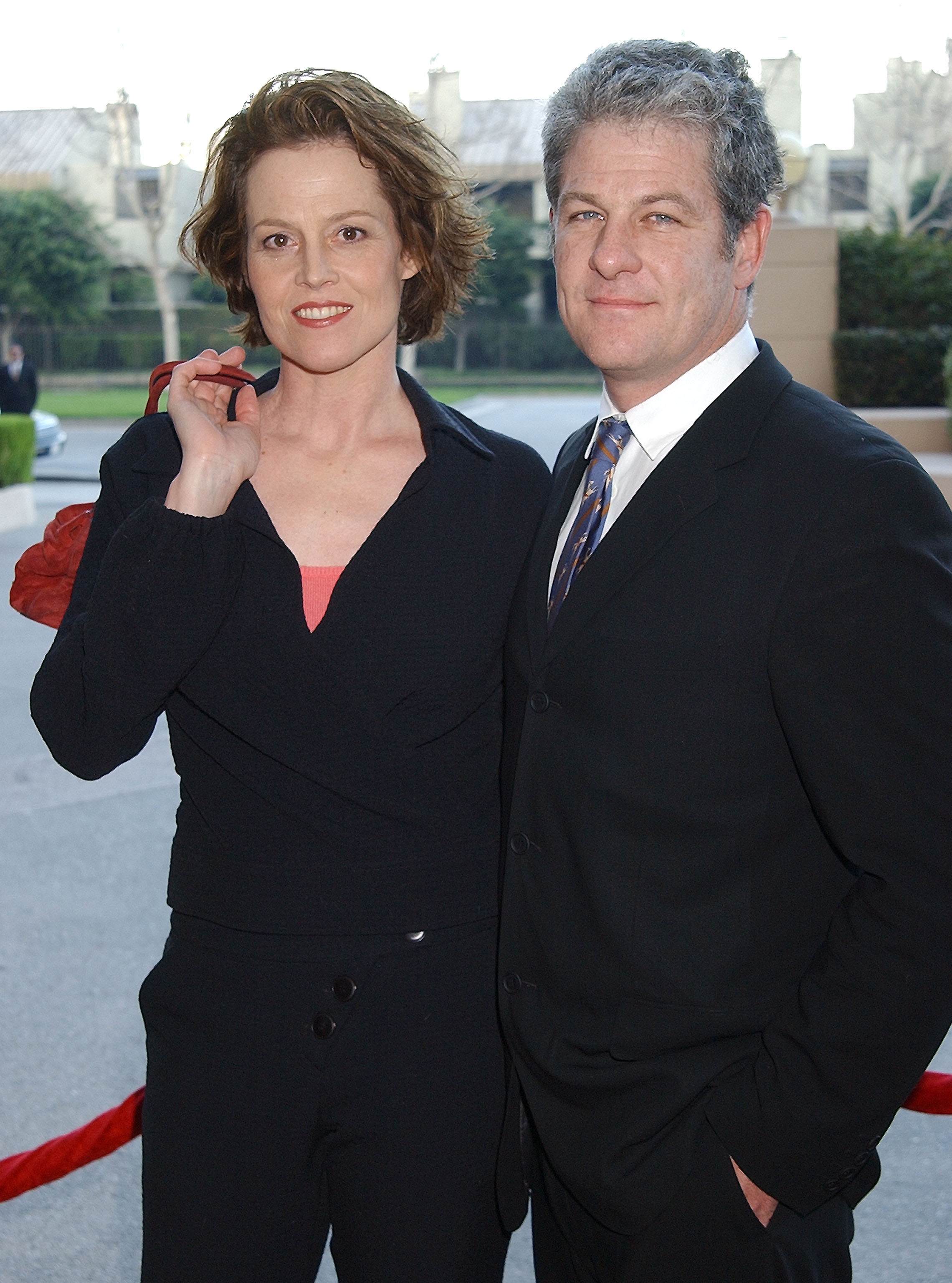 Sigourney Weaver and her husband, Jim Simpson, during the 9th Annual BAFTA/LA Tea Party in Los Angeles, California, on January 18, 2003 | Source: Getty Images