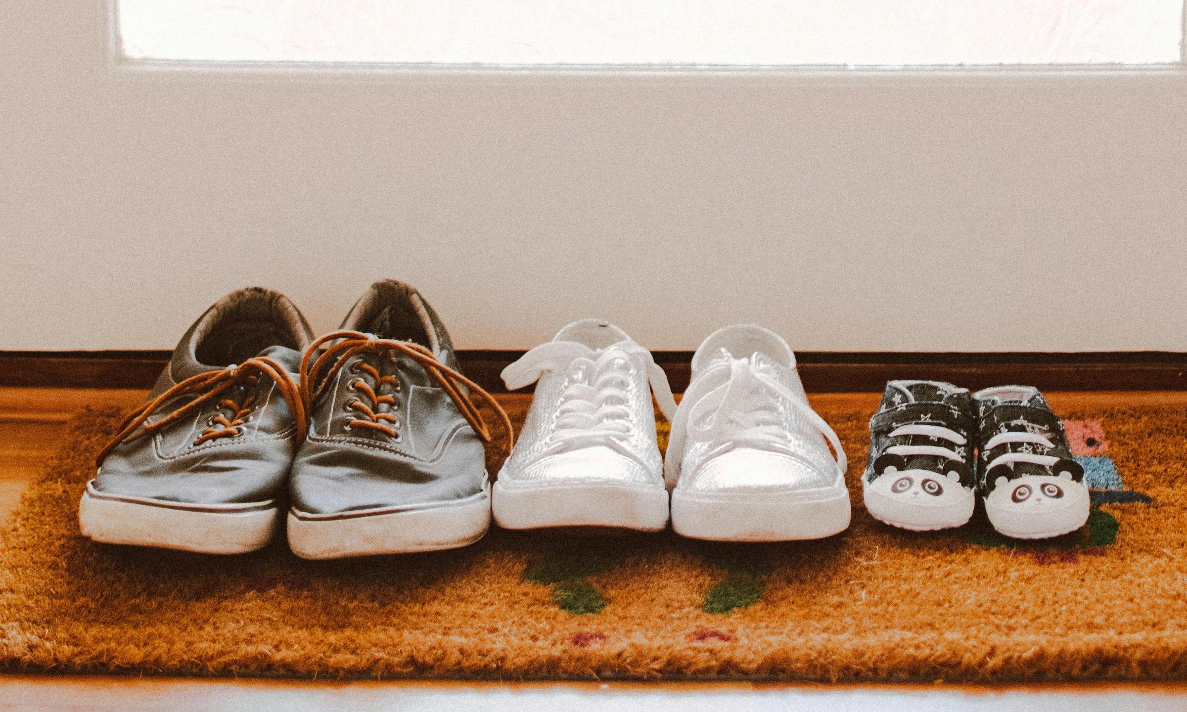 A line of unfamiliar shoes by the front door, hinting at a mystery | Source: Pexels