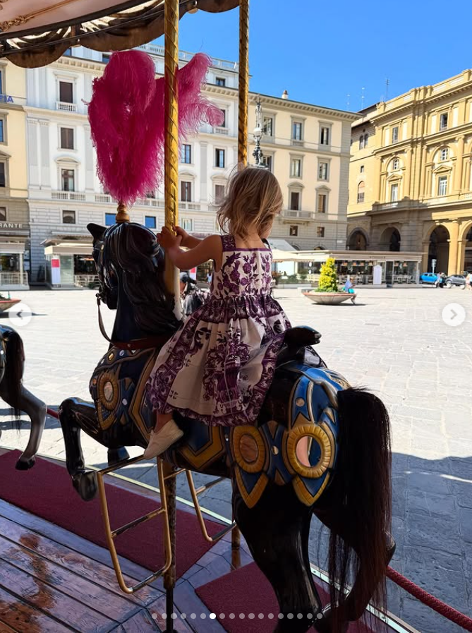 Kitty Spencer's daughter Athena riding on a carousel in Italy, from a post dated July 24, 2025. | Source: Instagram/kitty.spencer