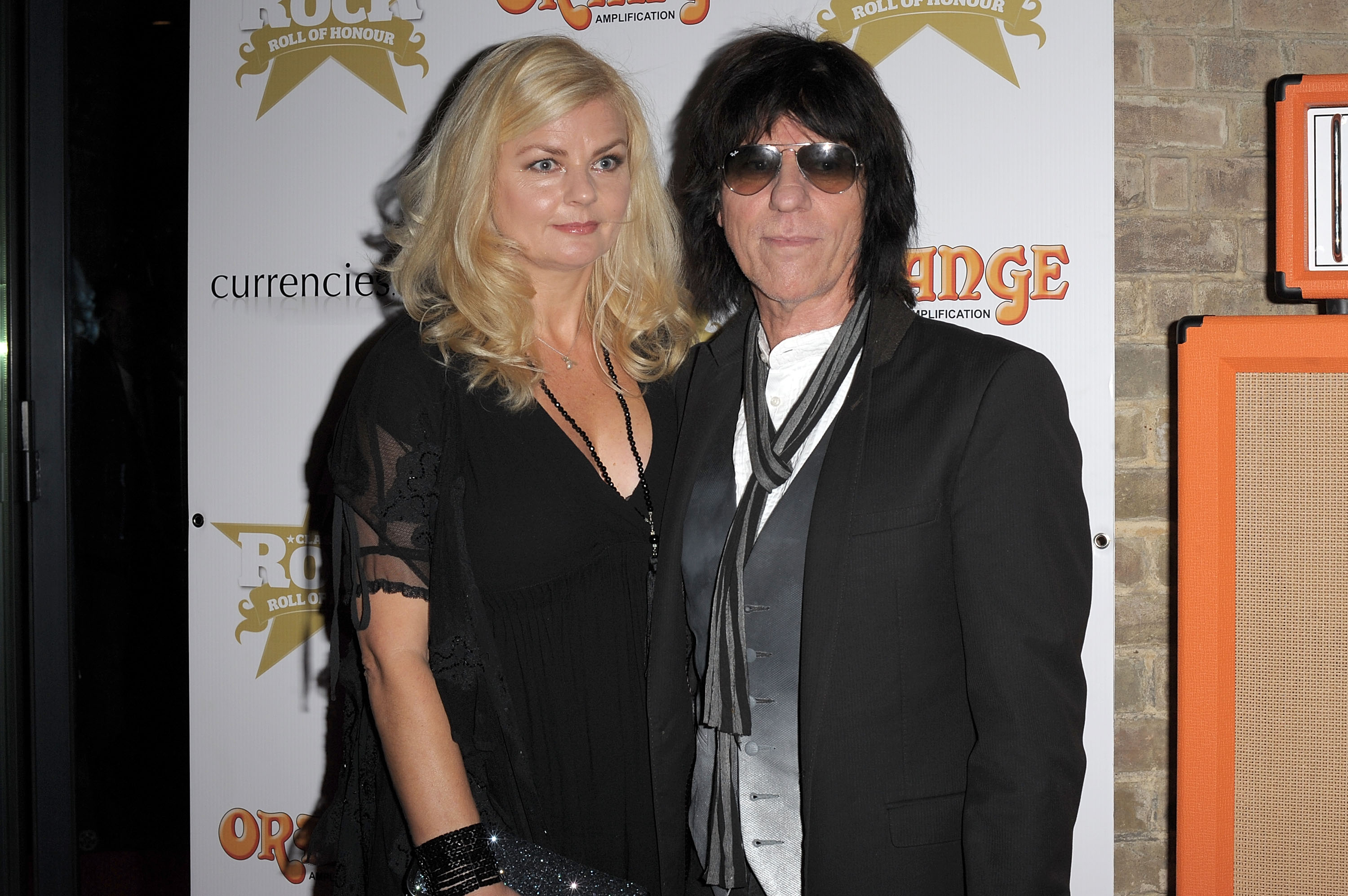 Sandra Cash and Jeff Beck pose for photos at The 'Classic Rock Roll of Honour' honouring rock's biggest icons at The Roundhouse on November 9, 2011, in London, England | Source: Getty Images