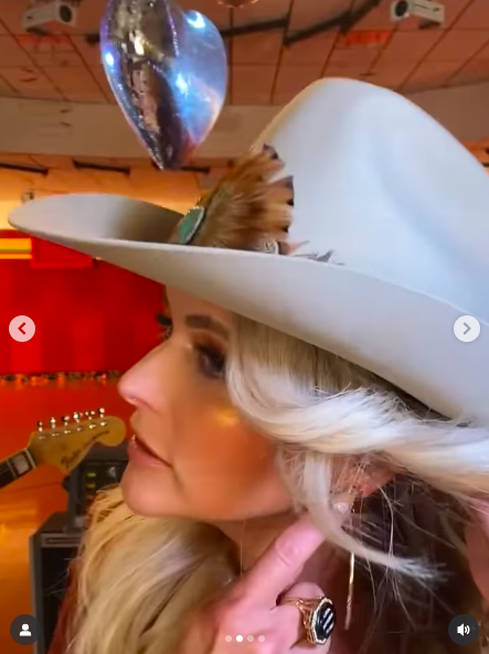 Miranda Lambert showing off Dolly Parton's hoops. | Source: Instagram/mirandalambert