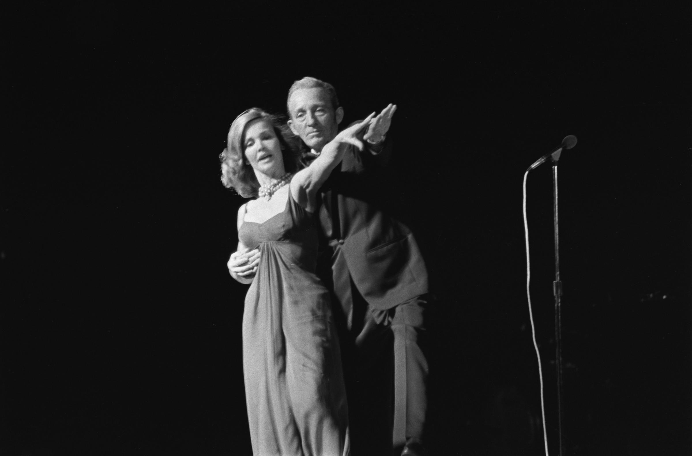 Kathryn Crosby performs on stage with Bing Crosby in UK, on June 22, 1976. | Source: Getty Images