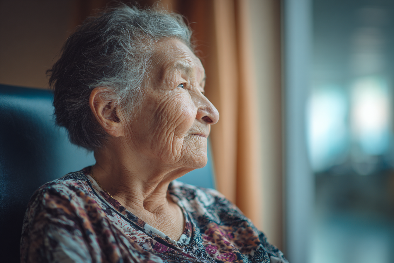 An older woman sitting in a hospital waiting area | Source: Midjourney