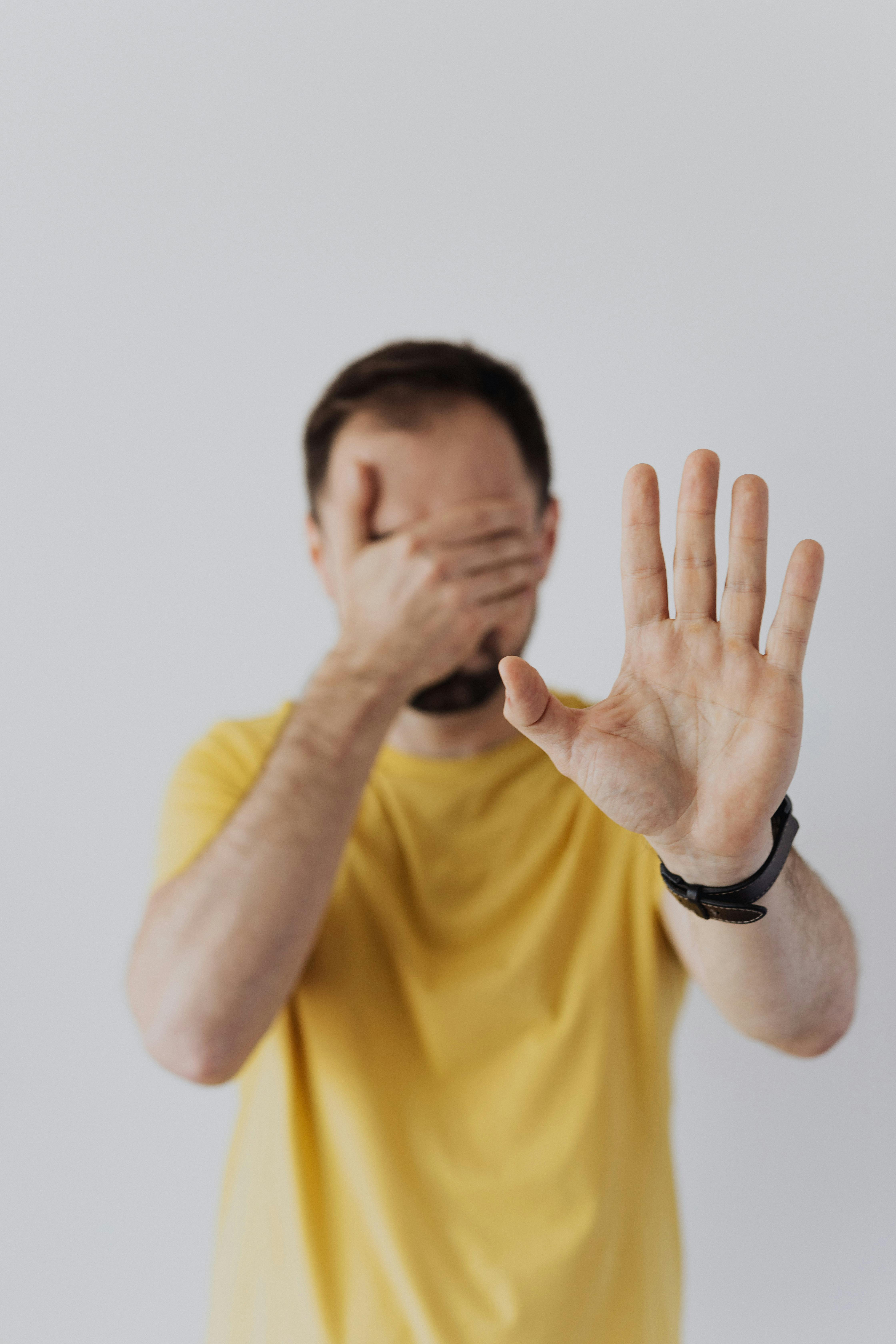 Man holding hands up | Source: Pexels