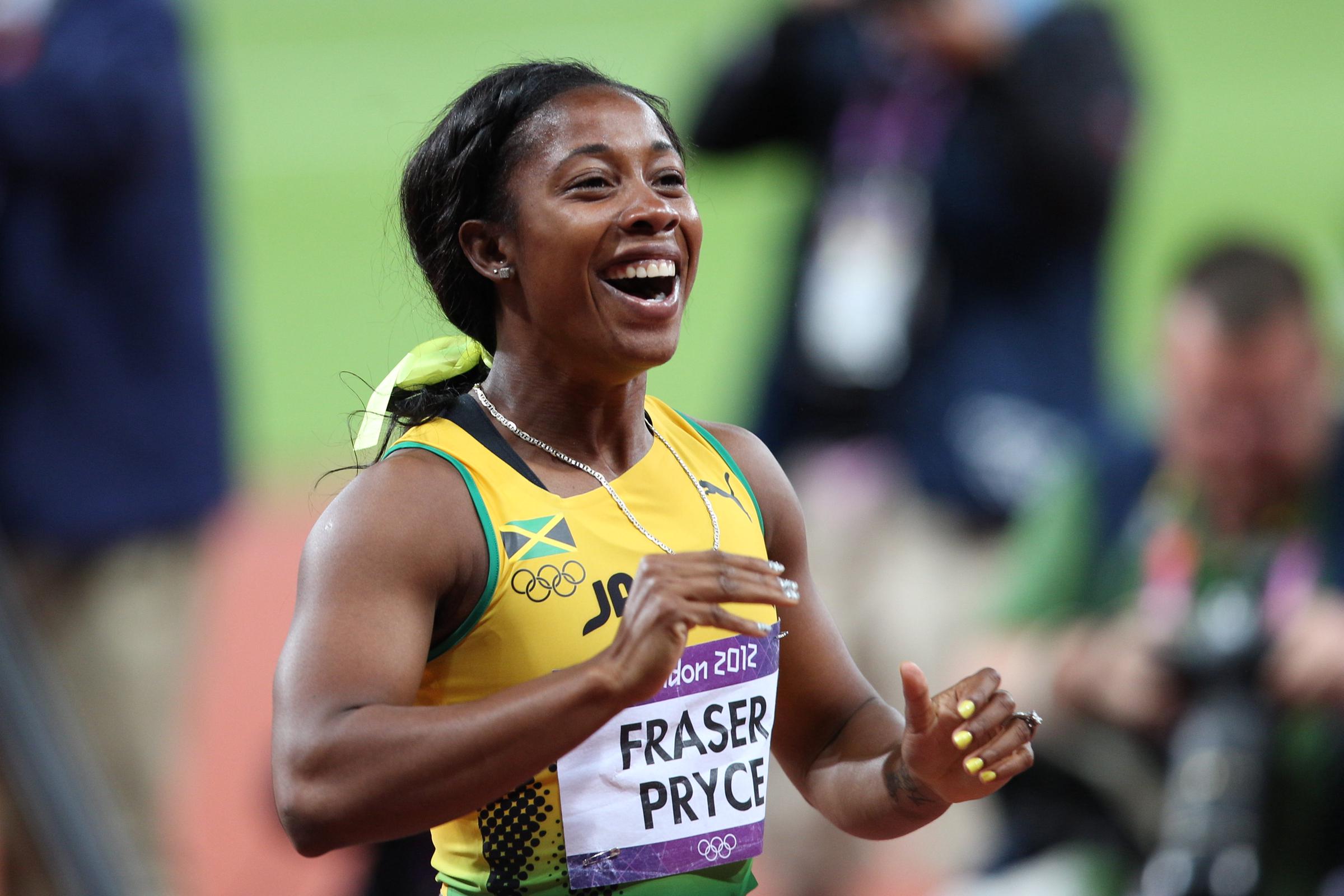 Shelly-Ann Fraser-Pryce celebrates after winning the Gold Medal in the Women's 100m Final during the London 2012 Olympic games on August 4, 2012, in London, England. | Source: Getty Images