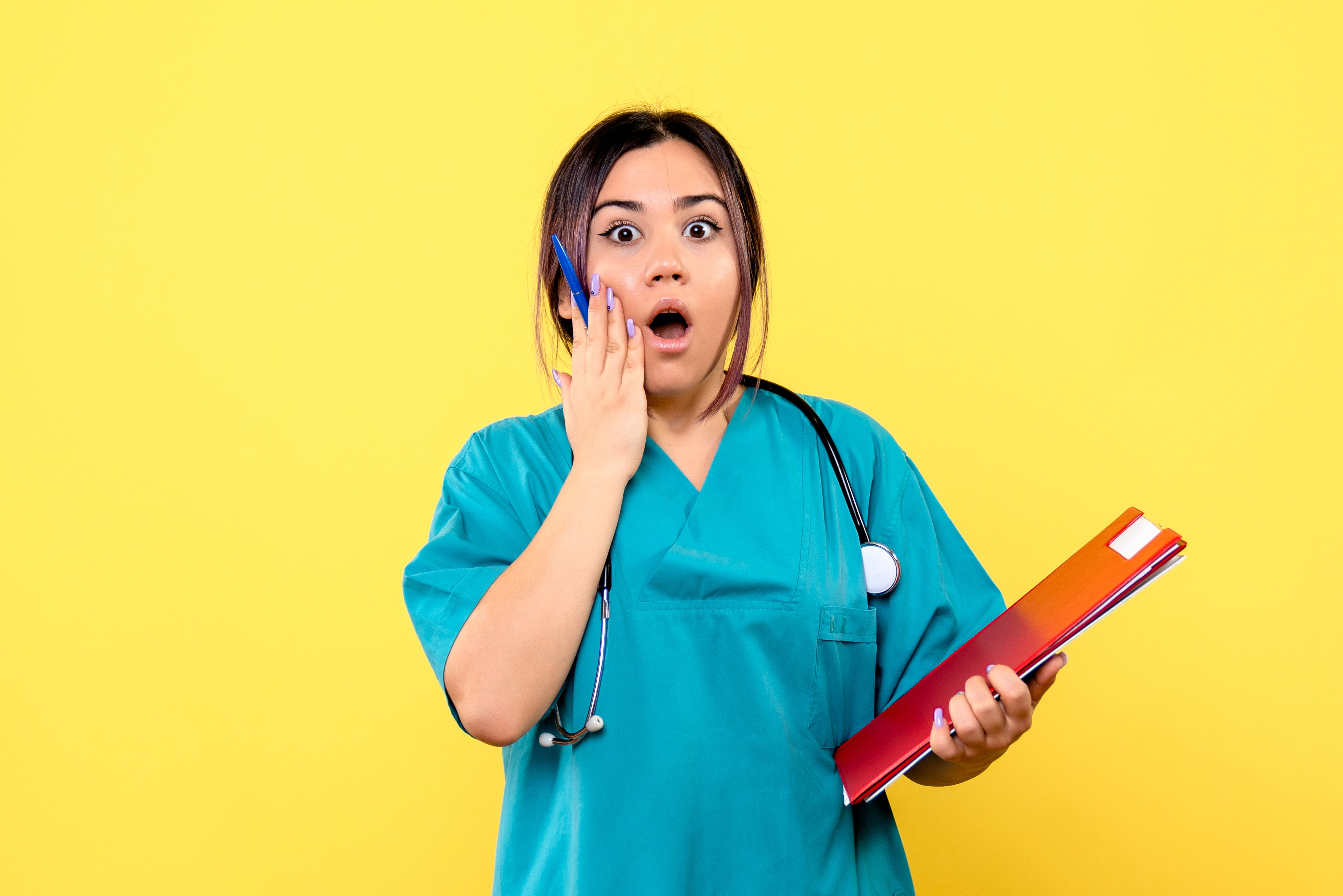 A shocked nurse | Source: Freepik