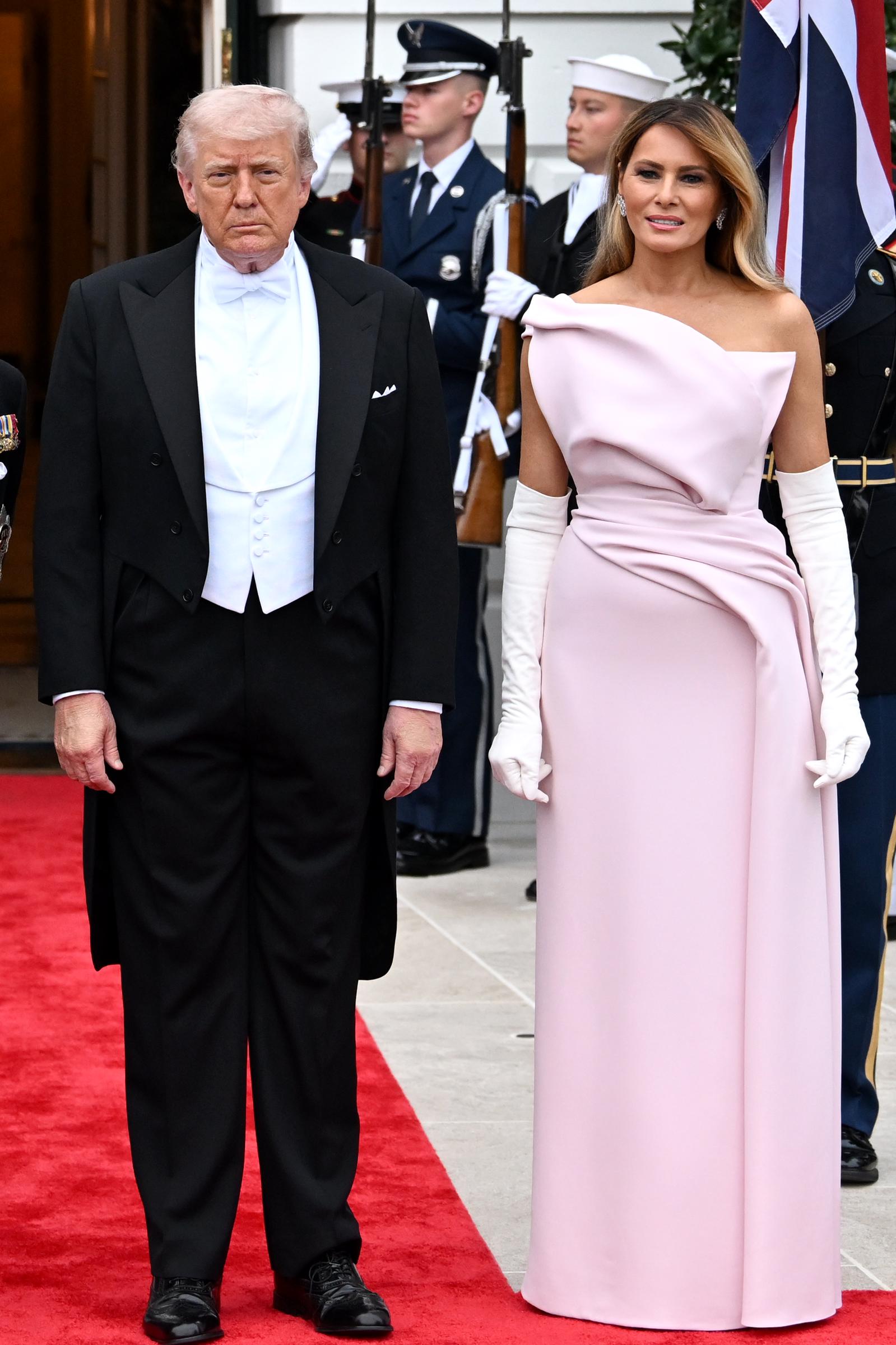 Donald Trump and Melania Trump pose outside during a State Dinner at the White House, April 28, 2026. | Source: Getty Images