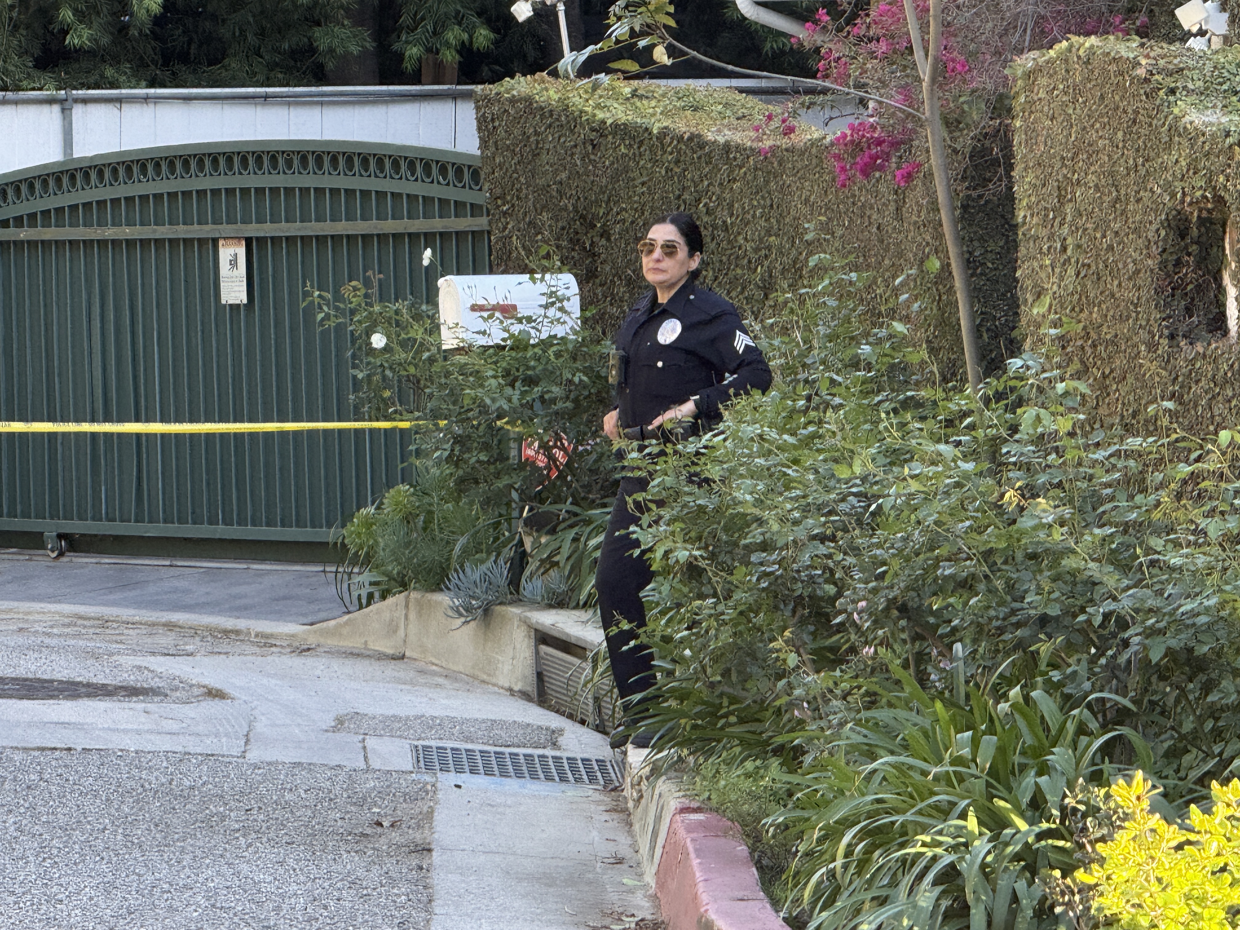 A police officer is seen outside Rihanna's home after a report of gunshots on March 08, 2026 in Beverly Hills, California | Source: Getty Images