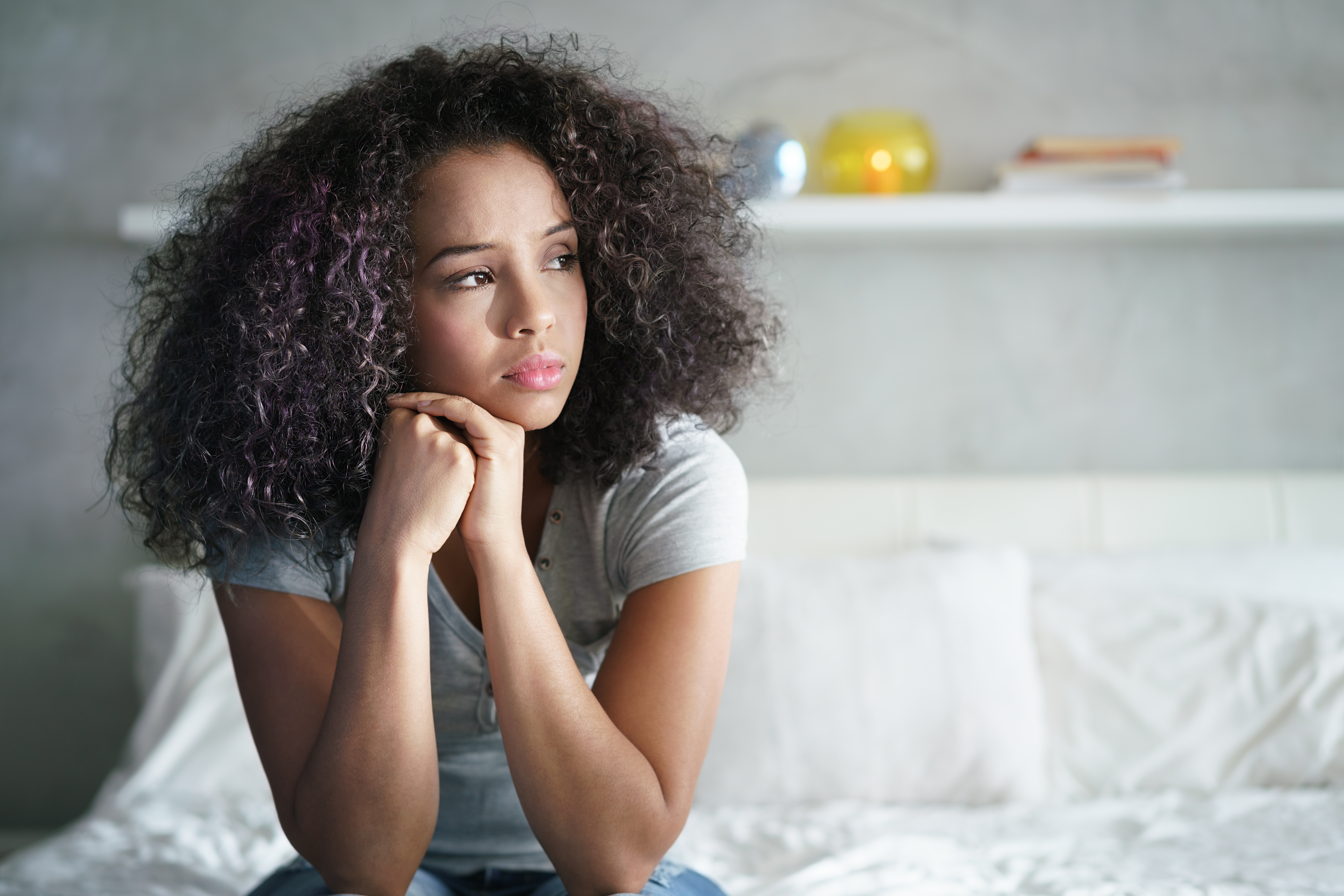 A depressed black woman | Source: Shutterstock