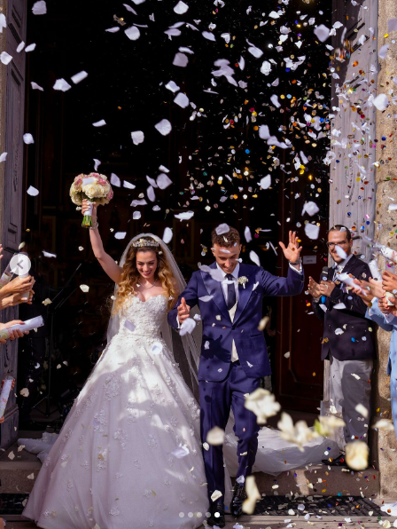 Rute Cardoso and Diogo Jota walking out of the church after tying the knot. | Source: Instagram/rutecfcardoso14