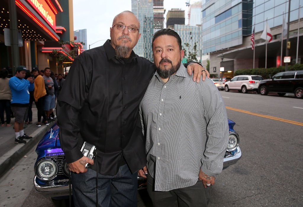 Estevan Oriol and Mister Cartoon arrive at the premiere for "Lowriders" at L.A. LIVE on May 9, 2017, in Los Angeles, California | Source: Jesse Grant/Getty Images