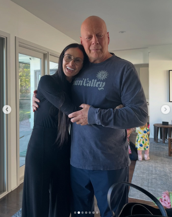 Bruce Willis and Demi Moore embrace, smiling warmly during the family celebration, posted on March 19, 2025 | Source: Instagram/demimoore