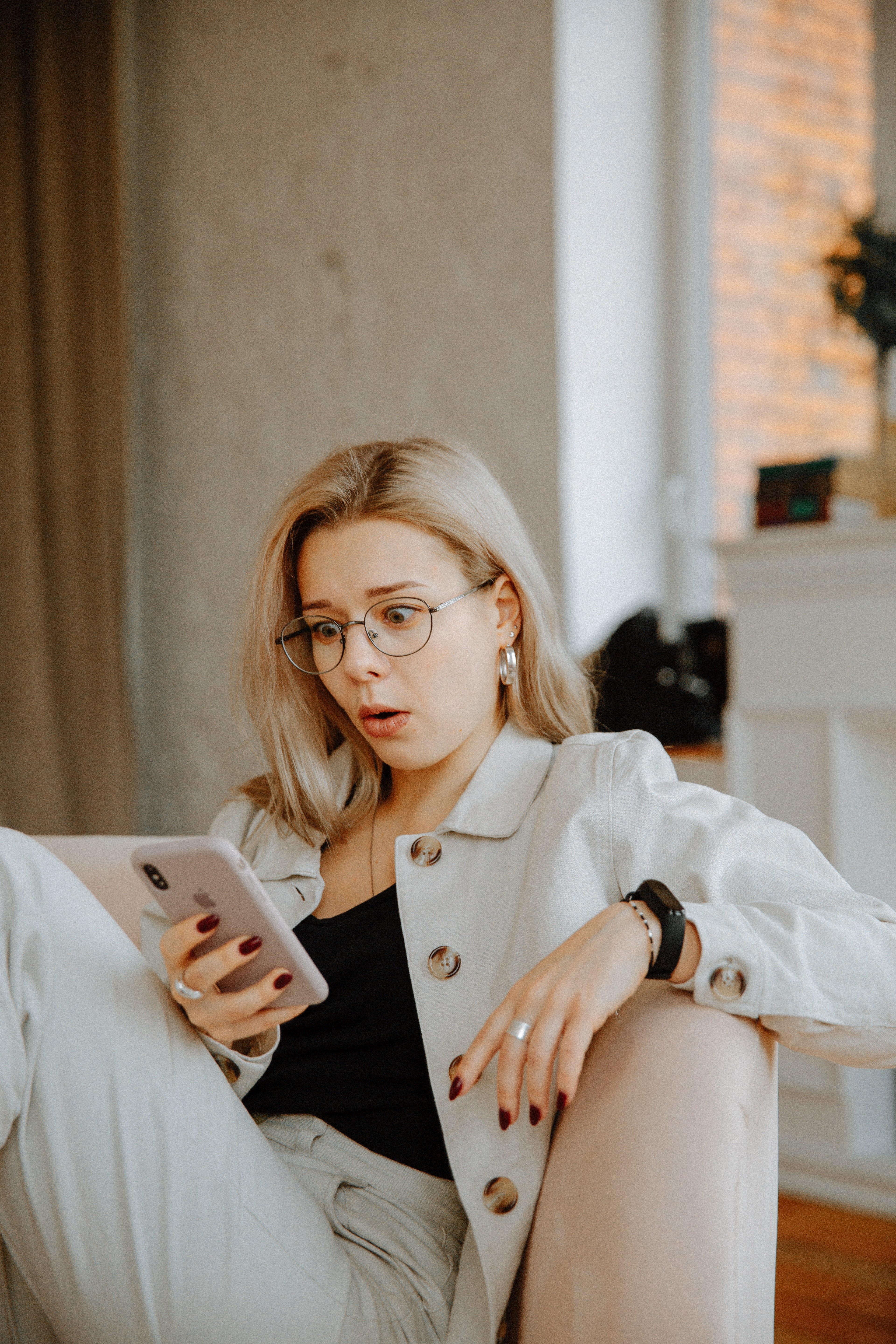 Woman looking shocked at her phone. | Source: Pexels/ Polina Zimmerman