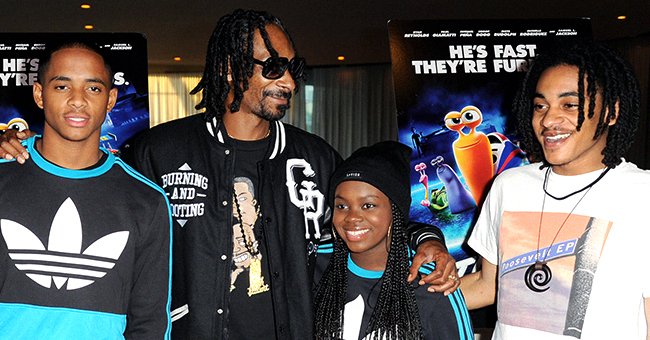 Cordell Broadus, Snoop Dogg, Cori Broadus and Corde Broadus attend the special screening of DreamWorks Animation "TURBO" at the Arclight Theatre on July 16, 2013 in Los Angeles, California. | Photo: Getty Images