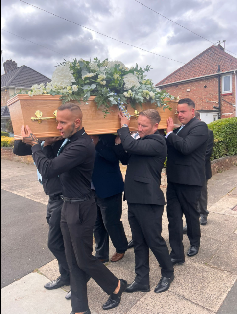 Mourners carrying a coffin with David's body inside from a post dated August 27, 2025 | Source: Facebook/rosefuneralsmemorials