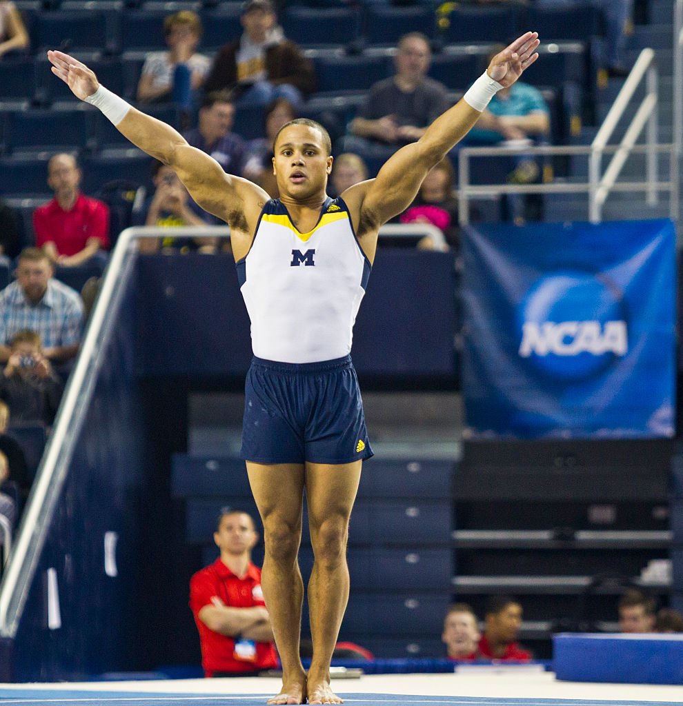 Olympic gymnast Stacey Ervin, Jr. shows off incredible routine during the 2014 national collegiate men's gymnastics championship in Michigan. | Photo: Getty Images