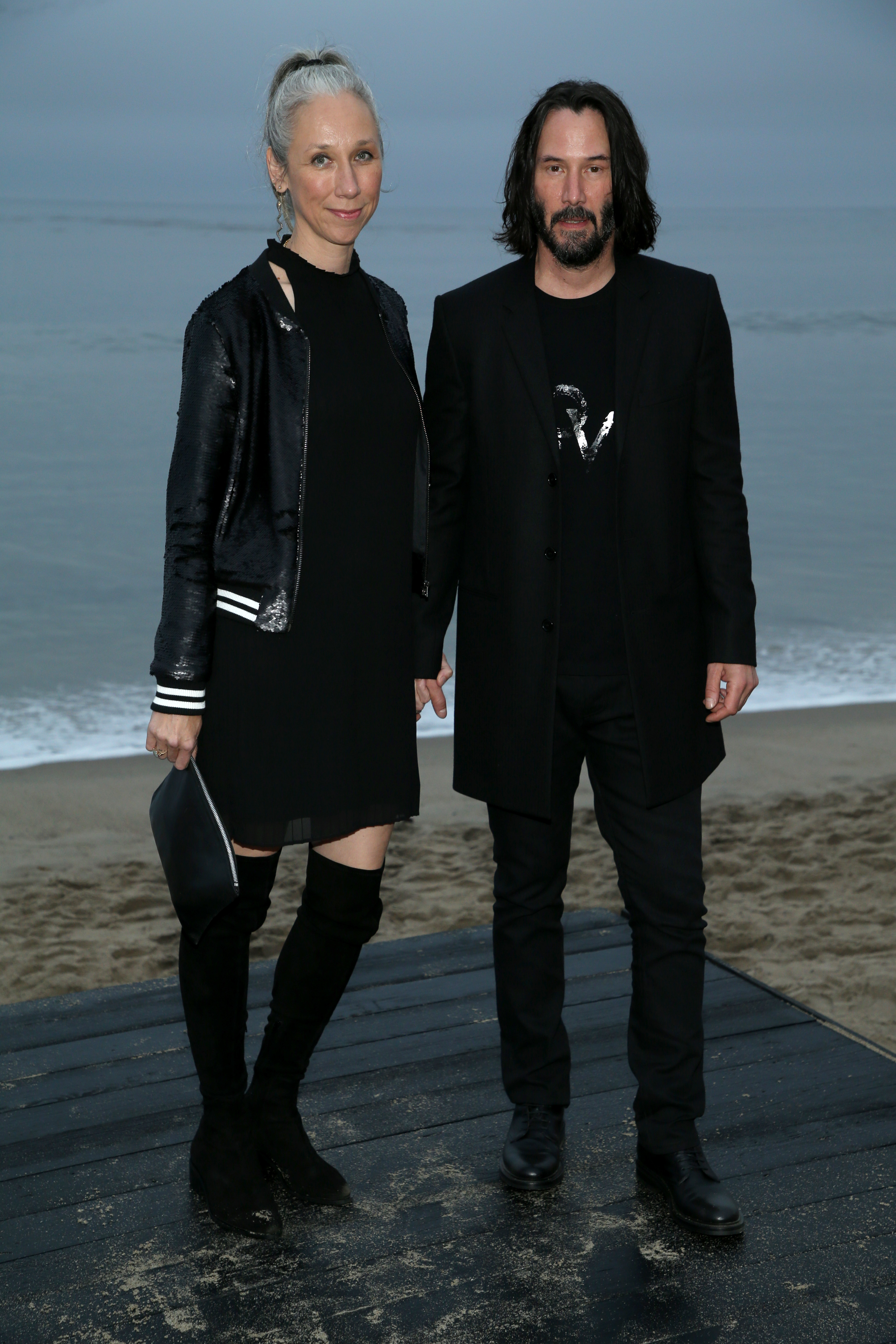 Alexandra Grant and Keanu Reeves attend the Saint Laurent Men's Spring/Summer 2020 show in Malibu, California, on June 6, 2019 | Source: Getty Images