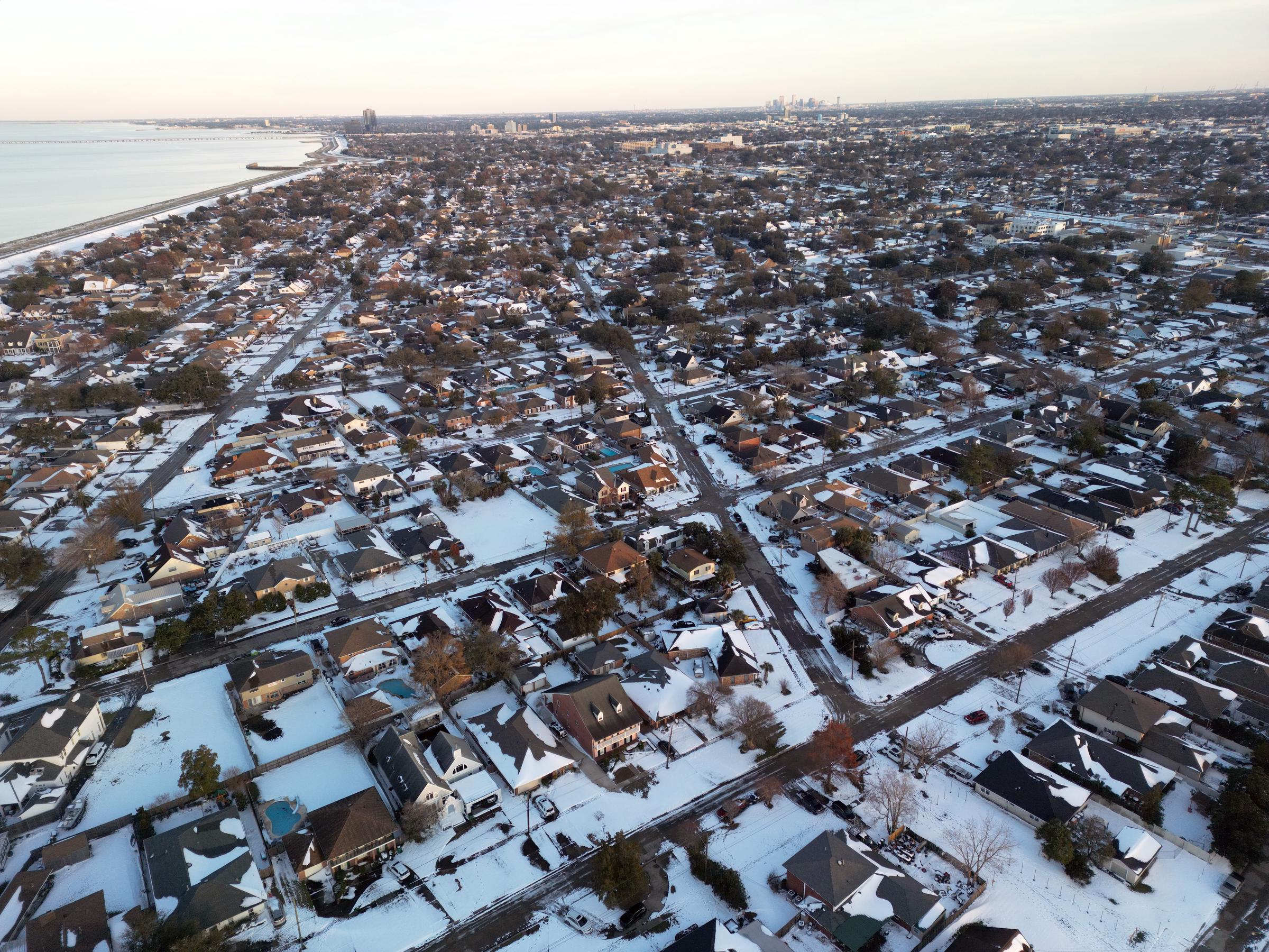 An aerial view of houses covered in snow in Metairie, Louisiana on January 22, 2025. | Source: Getty Images