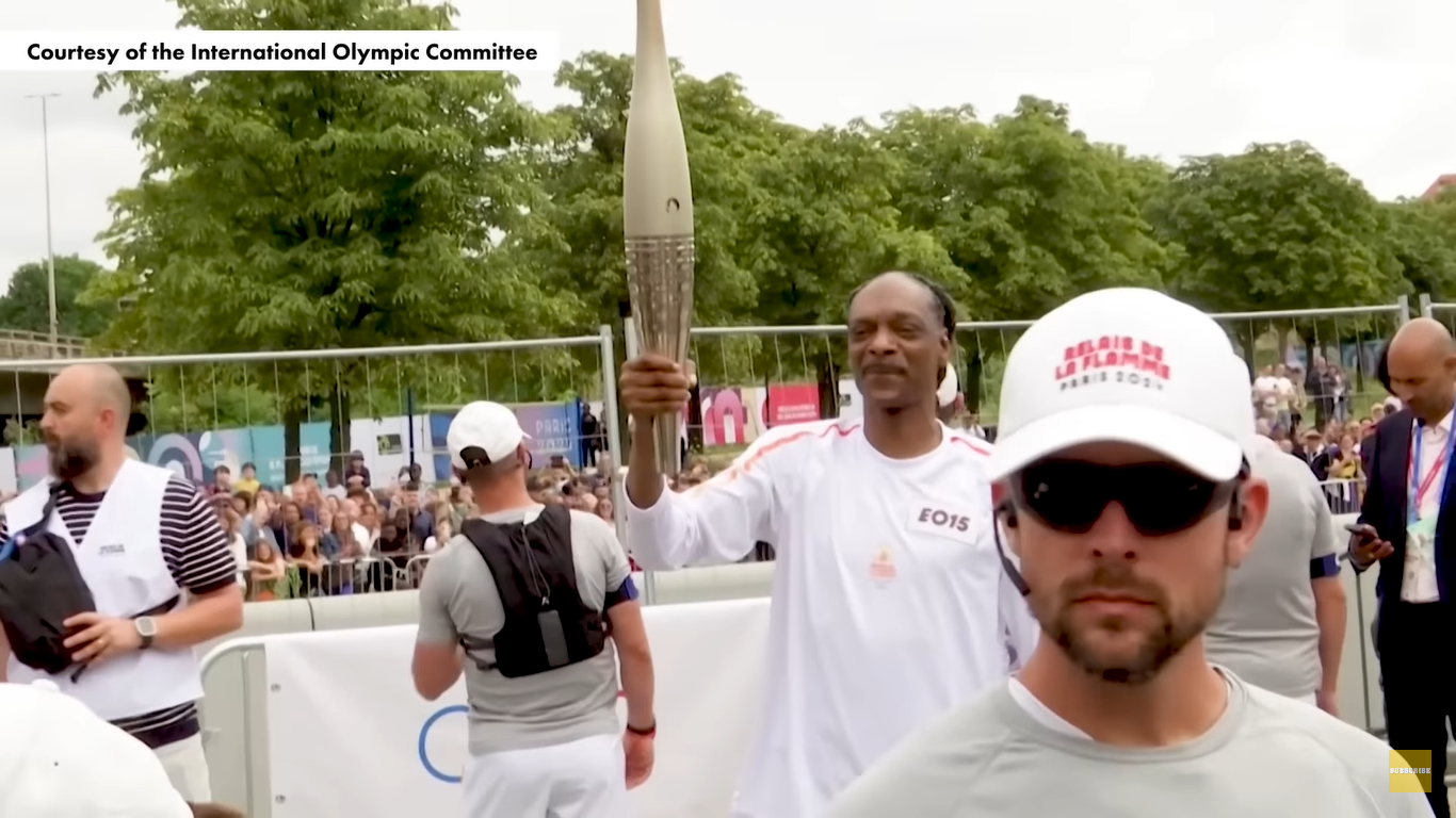 Snoop Dogg as a torch bearer for the 2024 Paris Olympics on July 26, 2024, in Paris, France. | Source: YouTube/PageSix