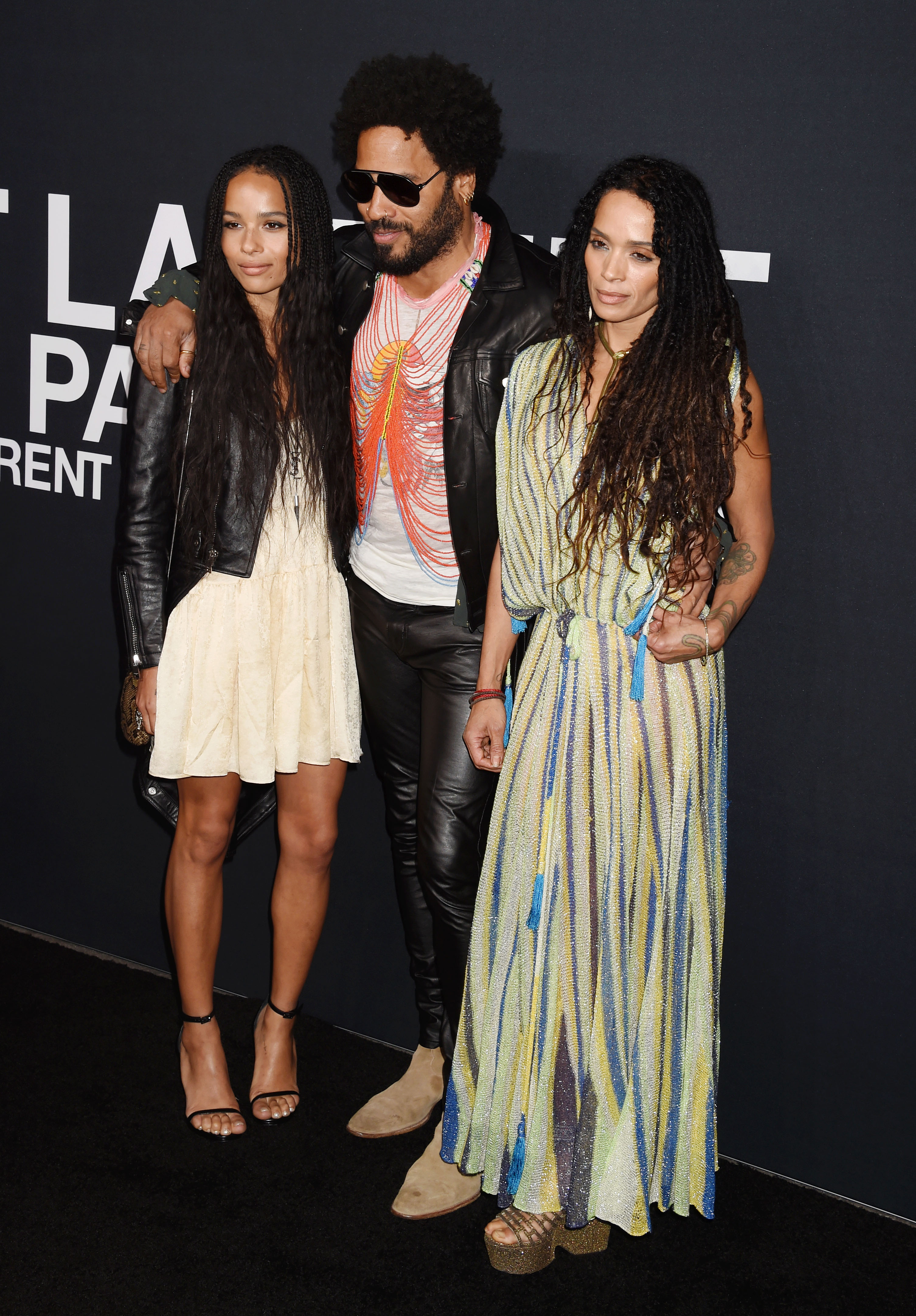 Zoe Kravitz, musician Lenny Kravitz and actress Lisa Bonet attend the Saint Laurent show at The Hollywood Palladium on February 10, 2016 in Los Angeles, California. | Source: Getty Images