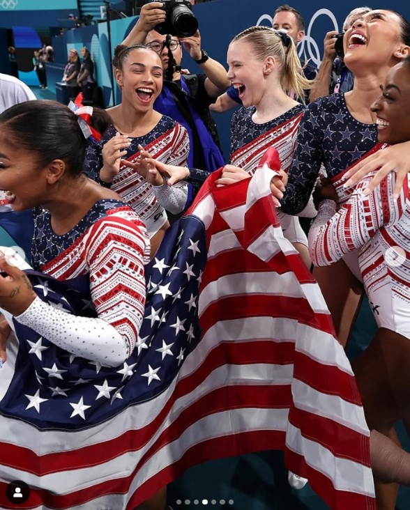 Hezly "Hez" Rivera and her US Women's Gymnastics teammates celebrating their gold medal win at the Paris Olympics in a social media post uploaded on July 30, 2024 | Source: Instagram/hezrivera