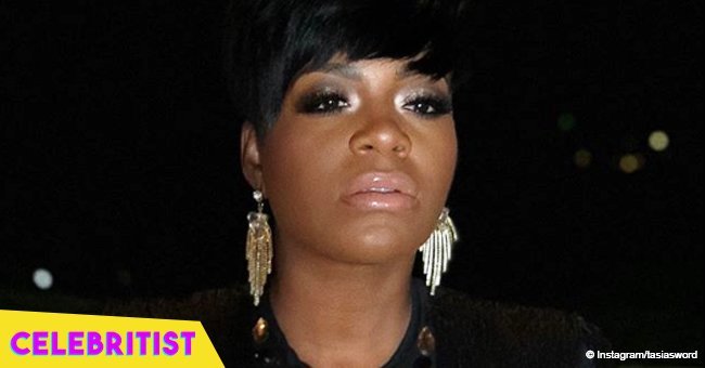 Fantasia stuns in long-sleeved midi dress in photo with her rarely seen father in church