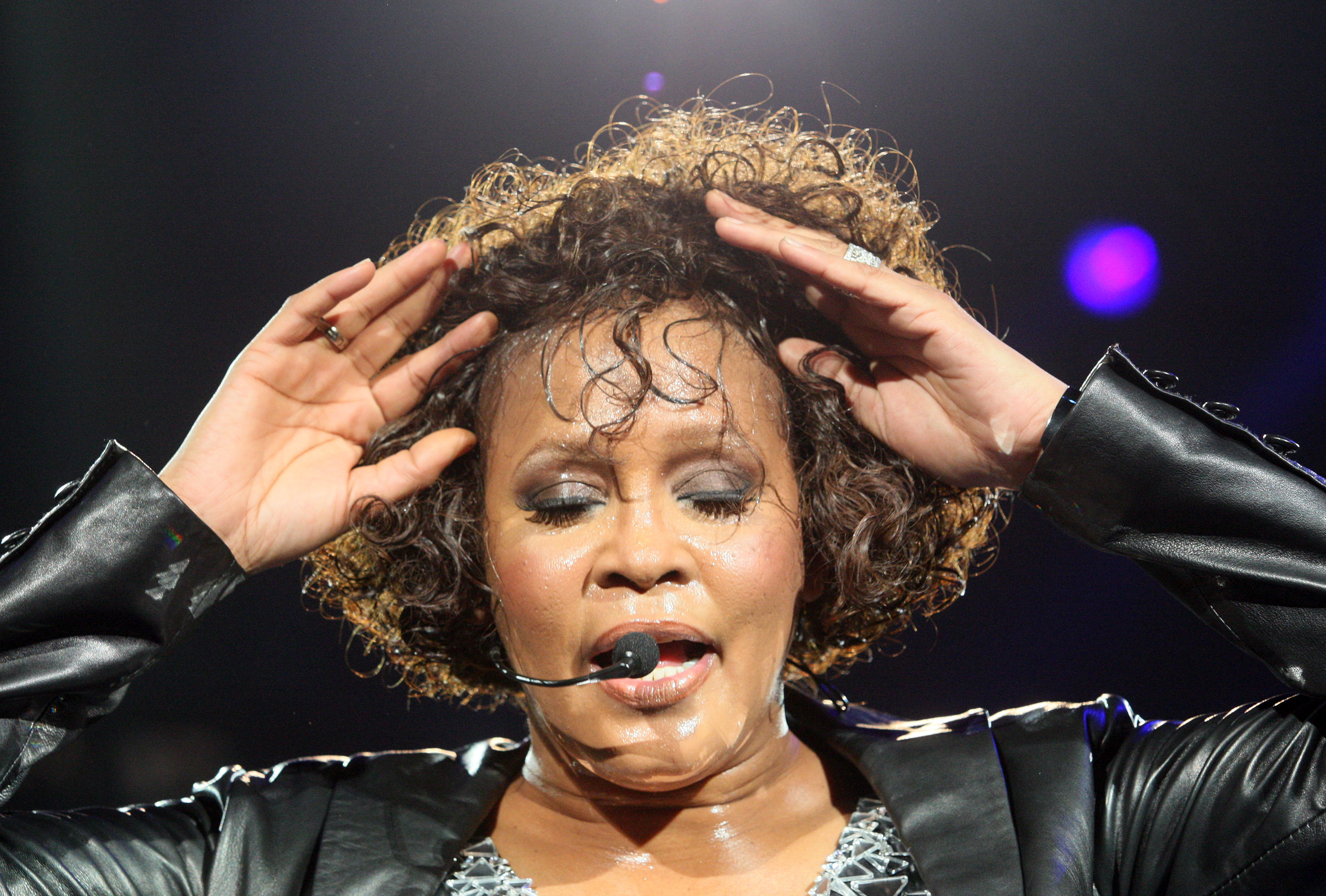 Whitney Houston performs on stage at Arena Nurnberger in Nuremberg, Germany, on May 27, 2010. | Source: Getty Images