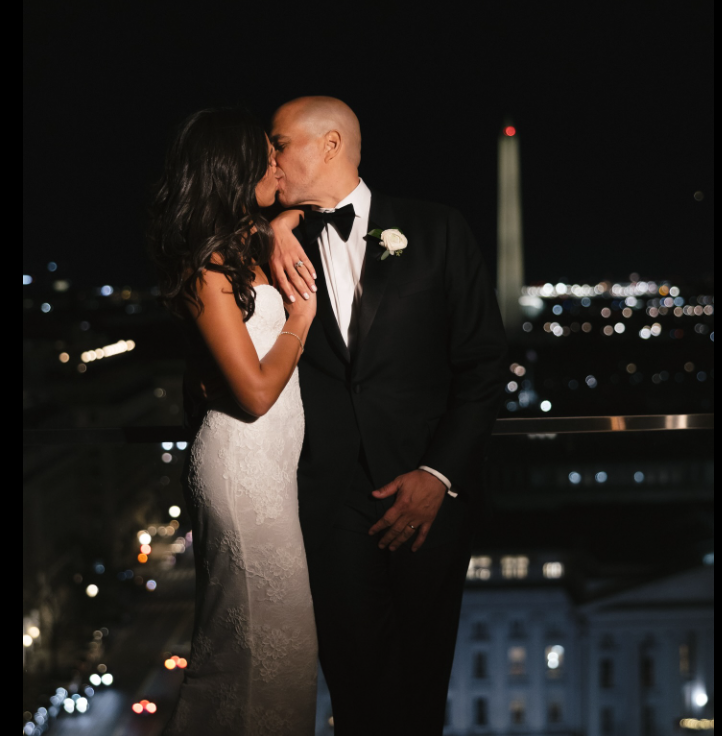 The couple share an intimate kiss on their wedding day, as seen from a post dated November 30, 2025. | Source: Facebook/CoryBooker