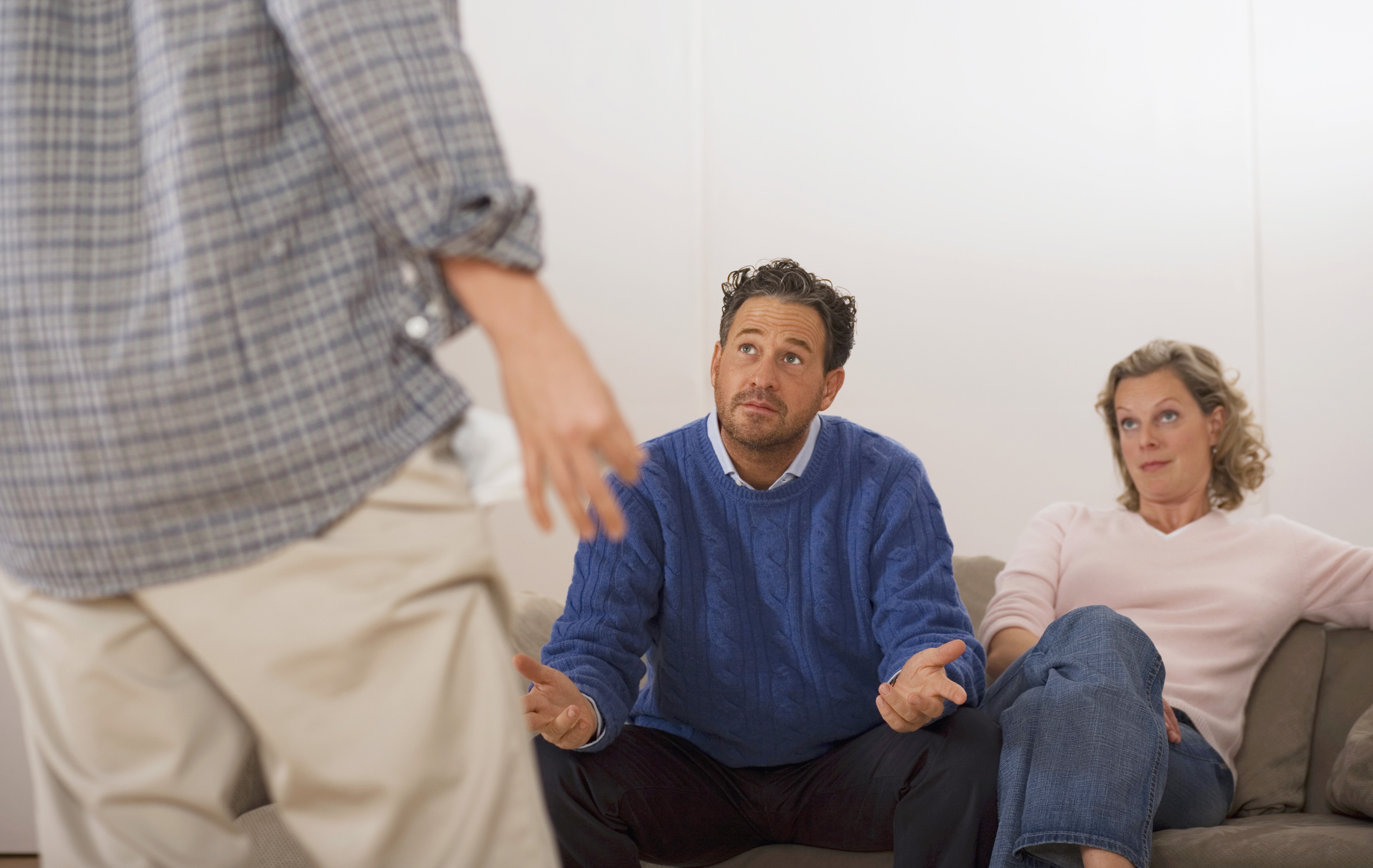 Man talking to parents | Source: Getty Images