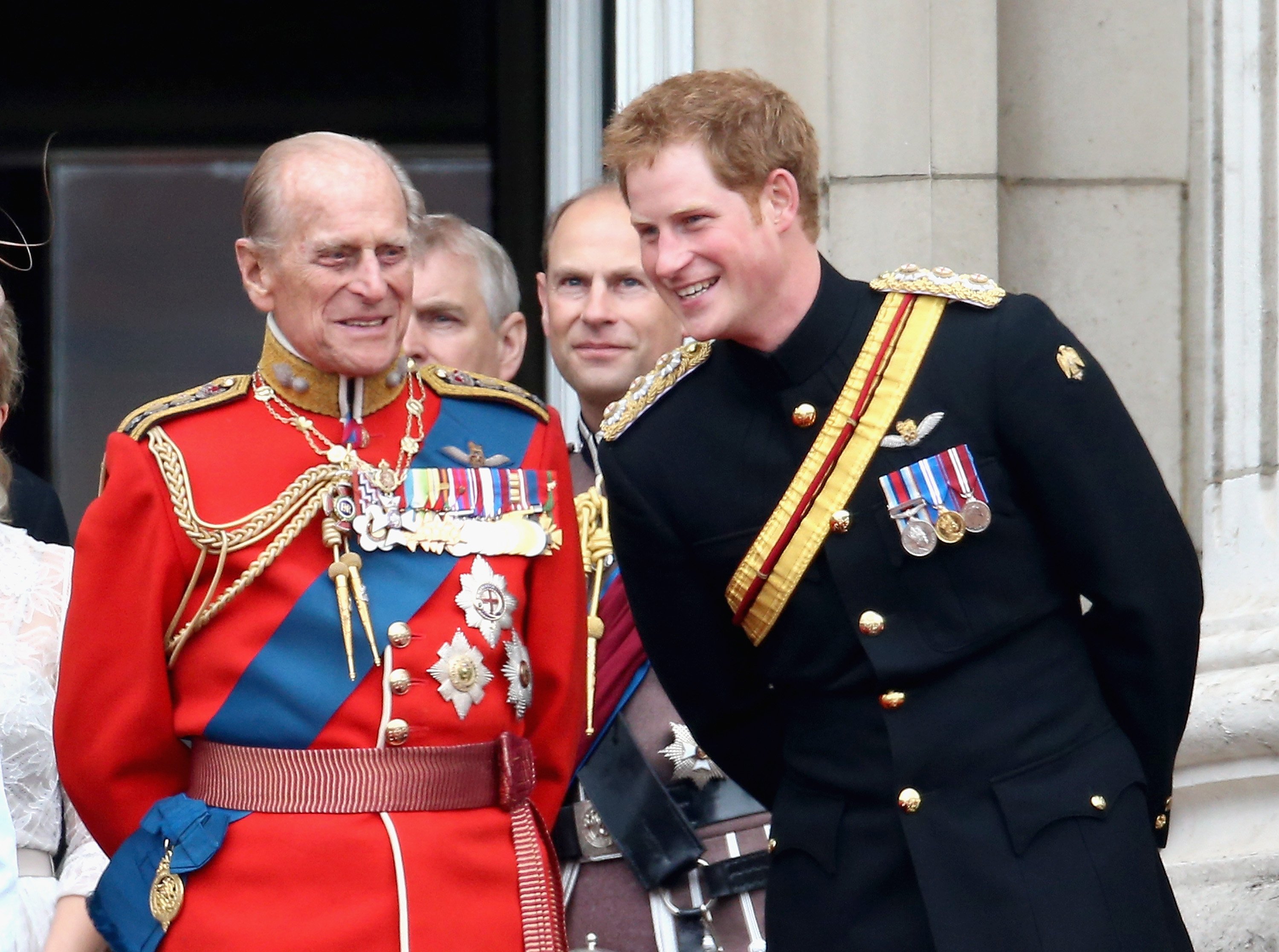 Prince Harry and Prince Philip, Duke of Edinburgh share a joke on the balcony during Trooping the Color - Queen Elizabeth II's Birthday Parade, at The Royal Horseguards on June 14, 2014 in London, England | Source: Getty Images