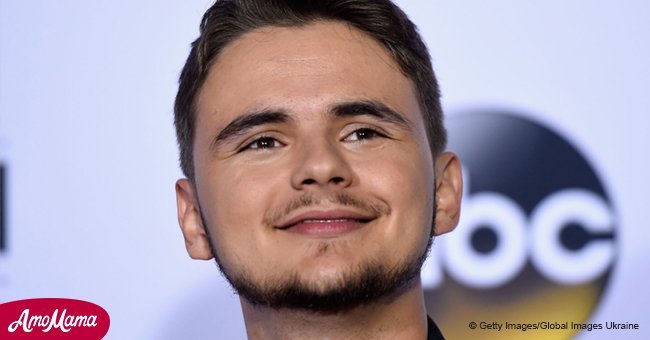 Prince Jackson dons a stylish dark suit while showing off his girlfriend in a rare snap