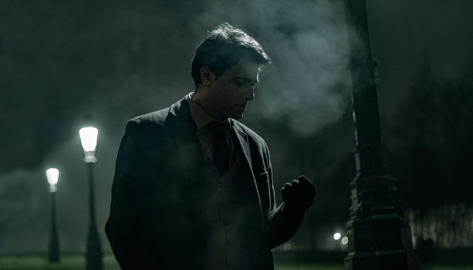 A man standing in a park at nighttime | Source: Pexels