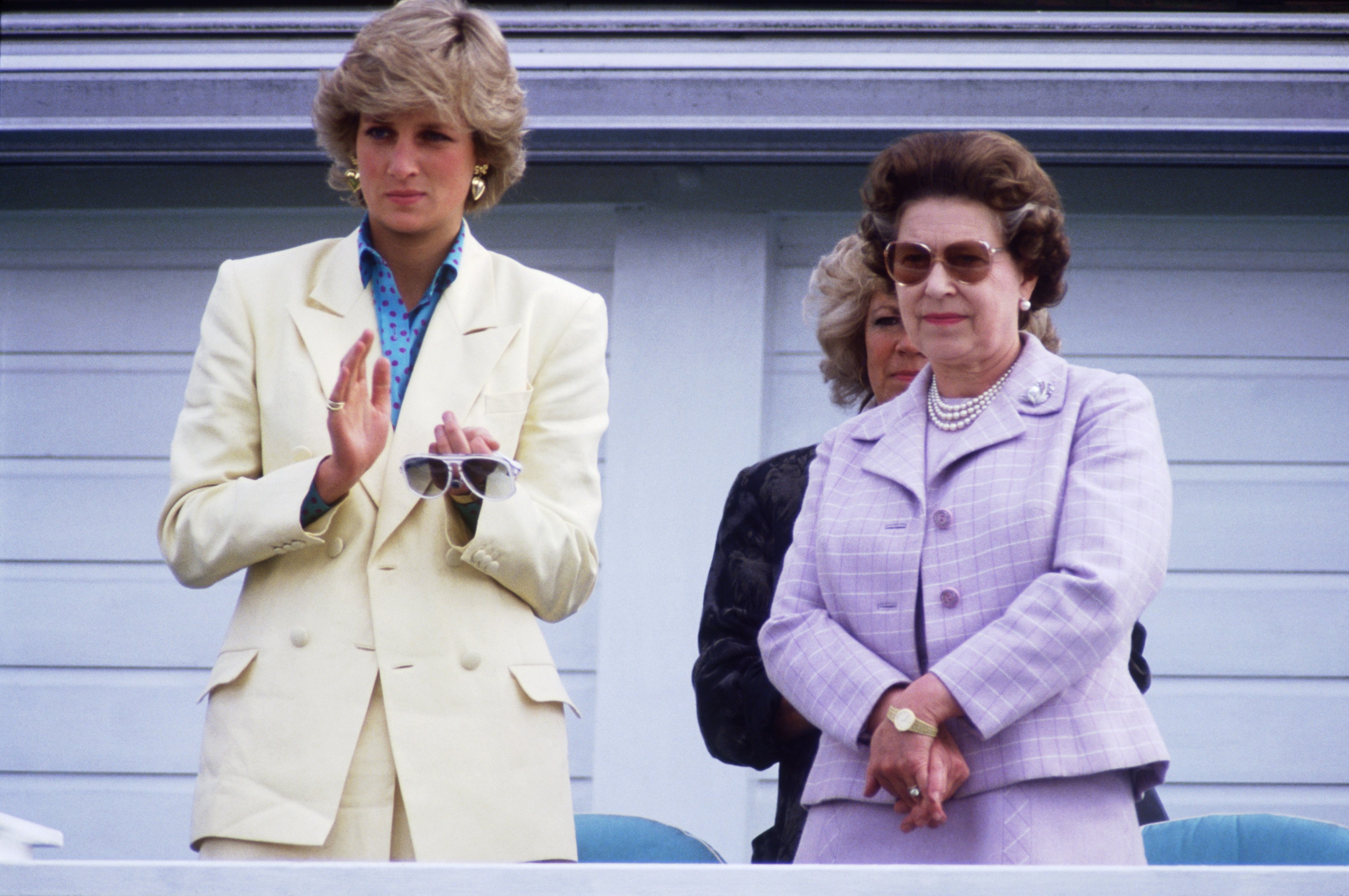 Queen Elizabeth II and Diana Princess of Wales watching Prince Charles playing in a polo match at Guards Polo Club, Smiths Lawn on May 31, 1987 | Photo: GettyImages