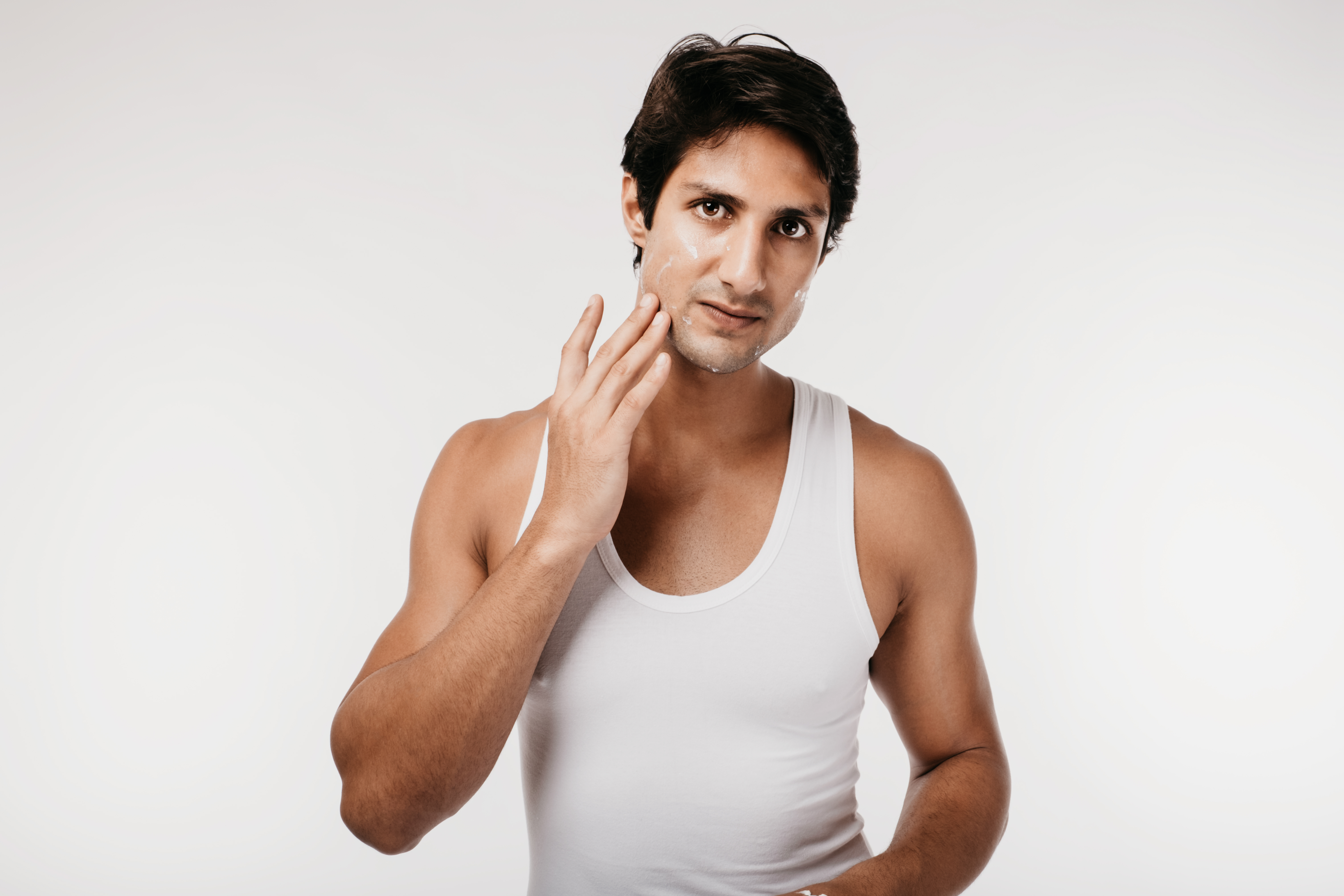 Man with sunscreen on his face | Source: Shutterstock