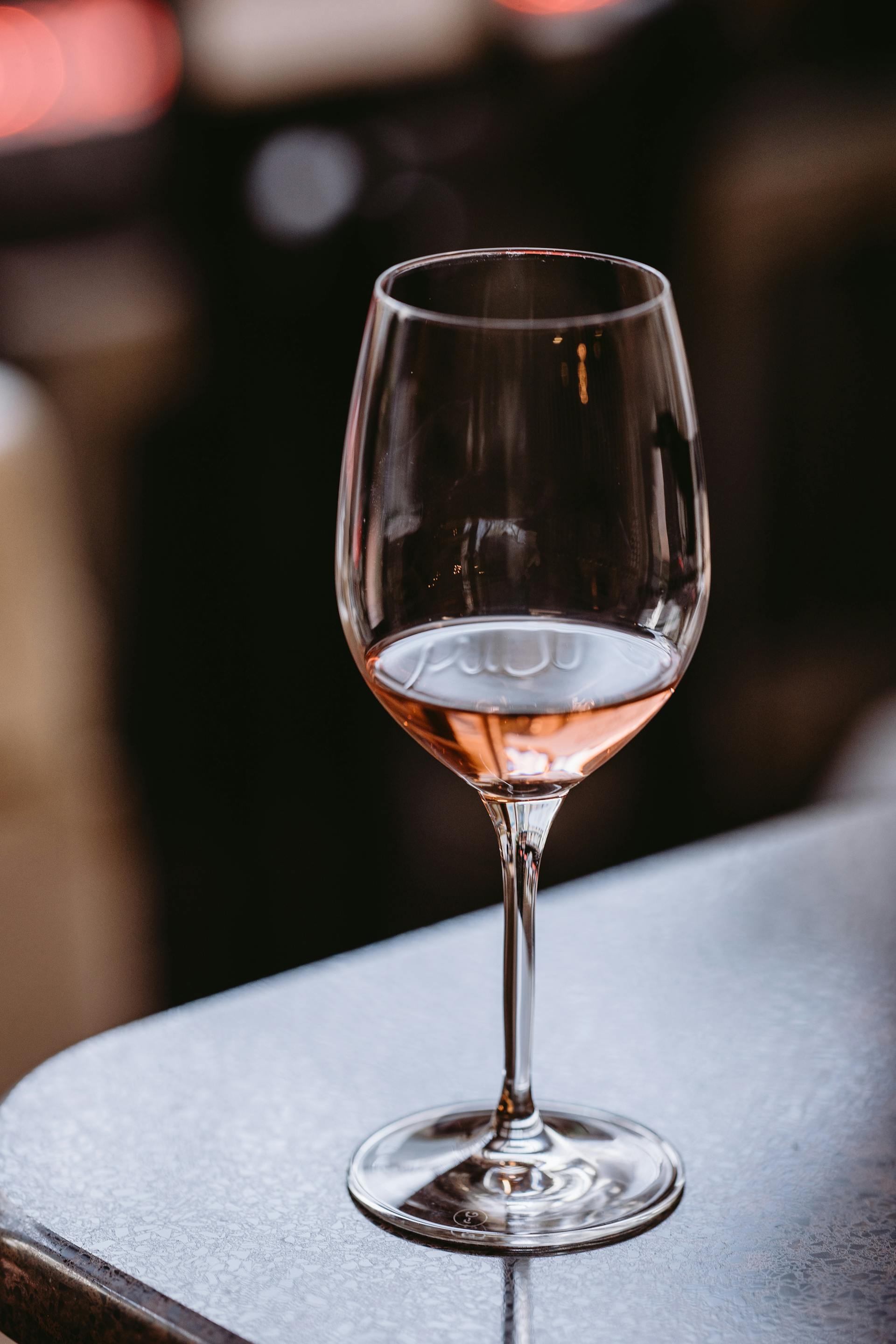 A glass of wine on a table | Source: Pexels