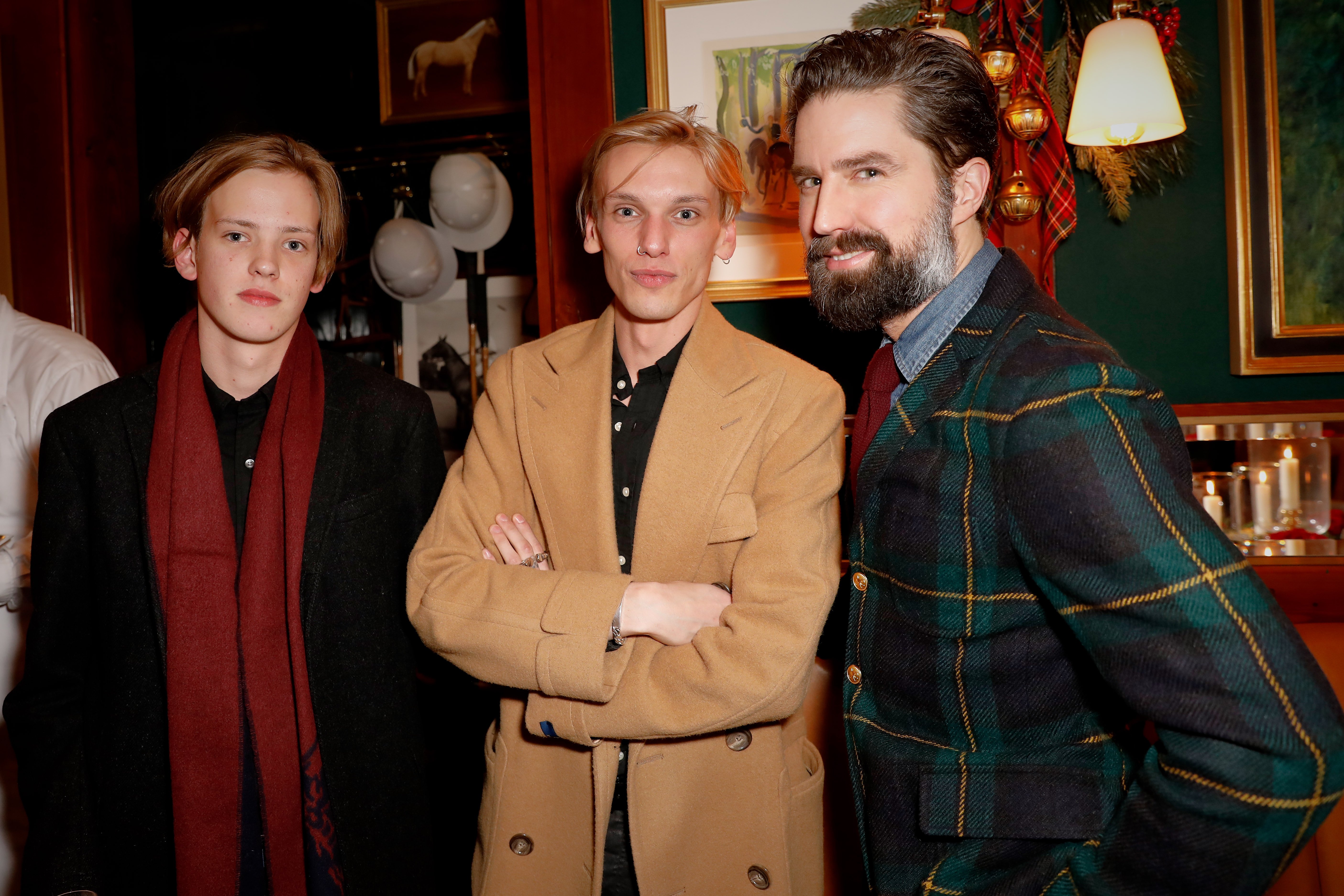 Jamie Campbell Bower, Sam Bower, and Jack Guinness attend the Polo Bear Holiday Dinner hosted on December 5, 2017, in London, England | Source: Getty Images