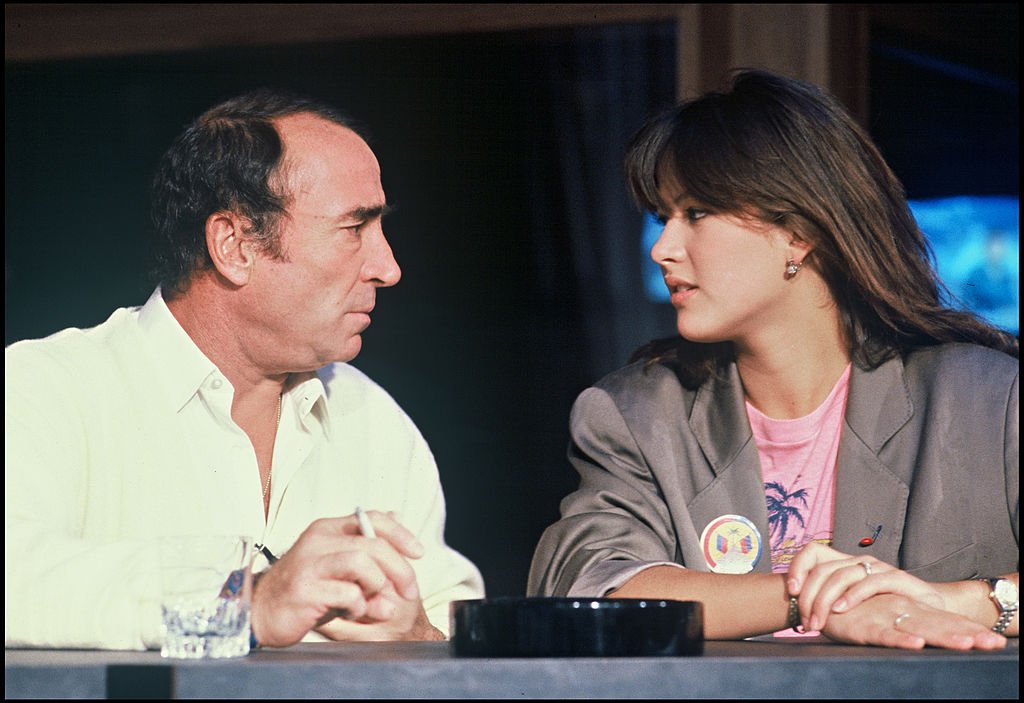 Claude Brasseur et Sophie Marceau dans le film  "Descente Aux Enfers", 1986| source : Getty Images