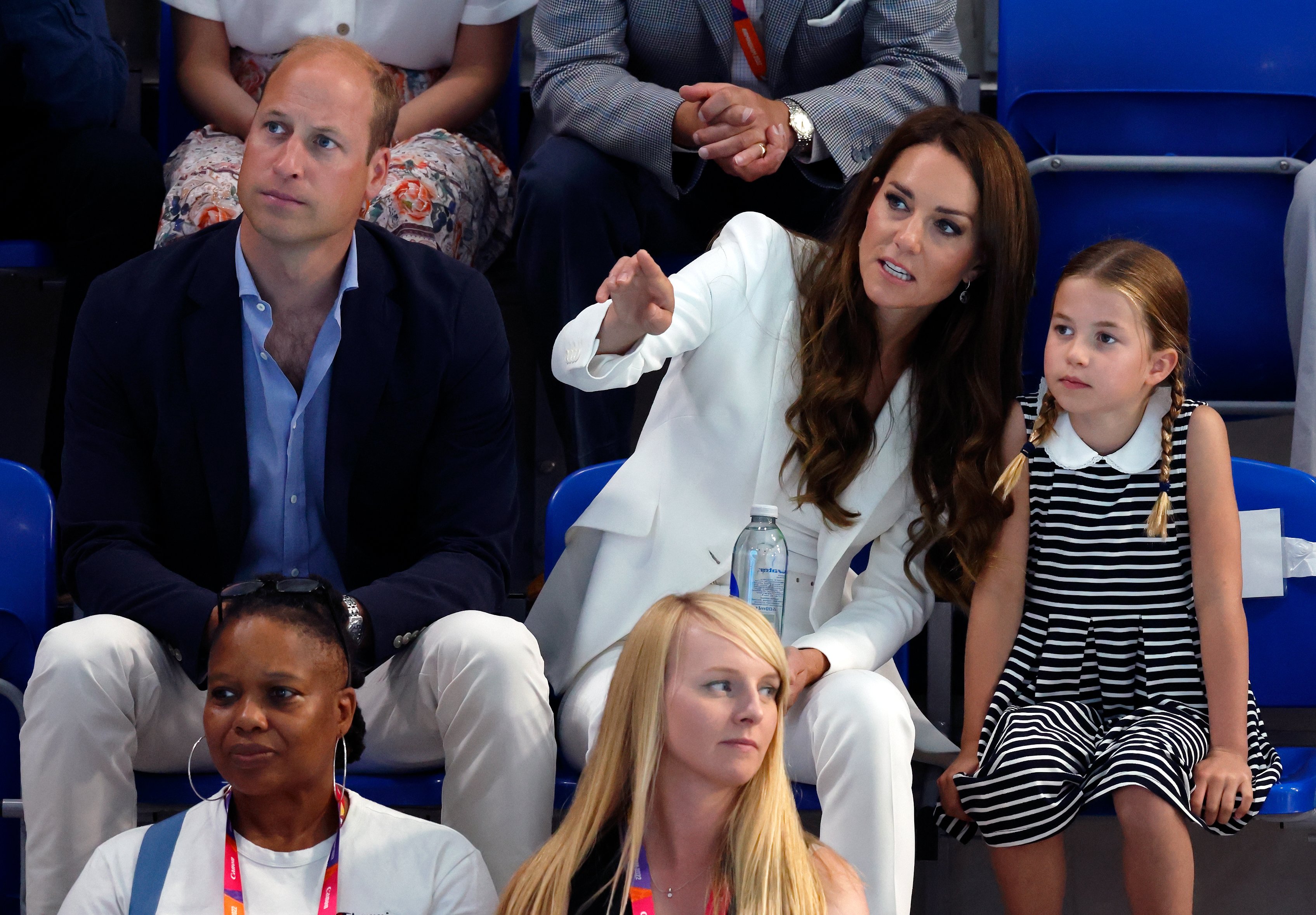 Prince William, Duke of Cambridge, Catherine, Duchess of Cambridge and Princess Charlotte of Cambridge watch the swimming competition at the Sandwell Aquatics Centre during the 2022 Commonwealth Games on August 2, 2022 in Birmingham, England | Source: Getty Images 