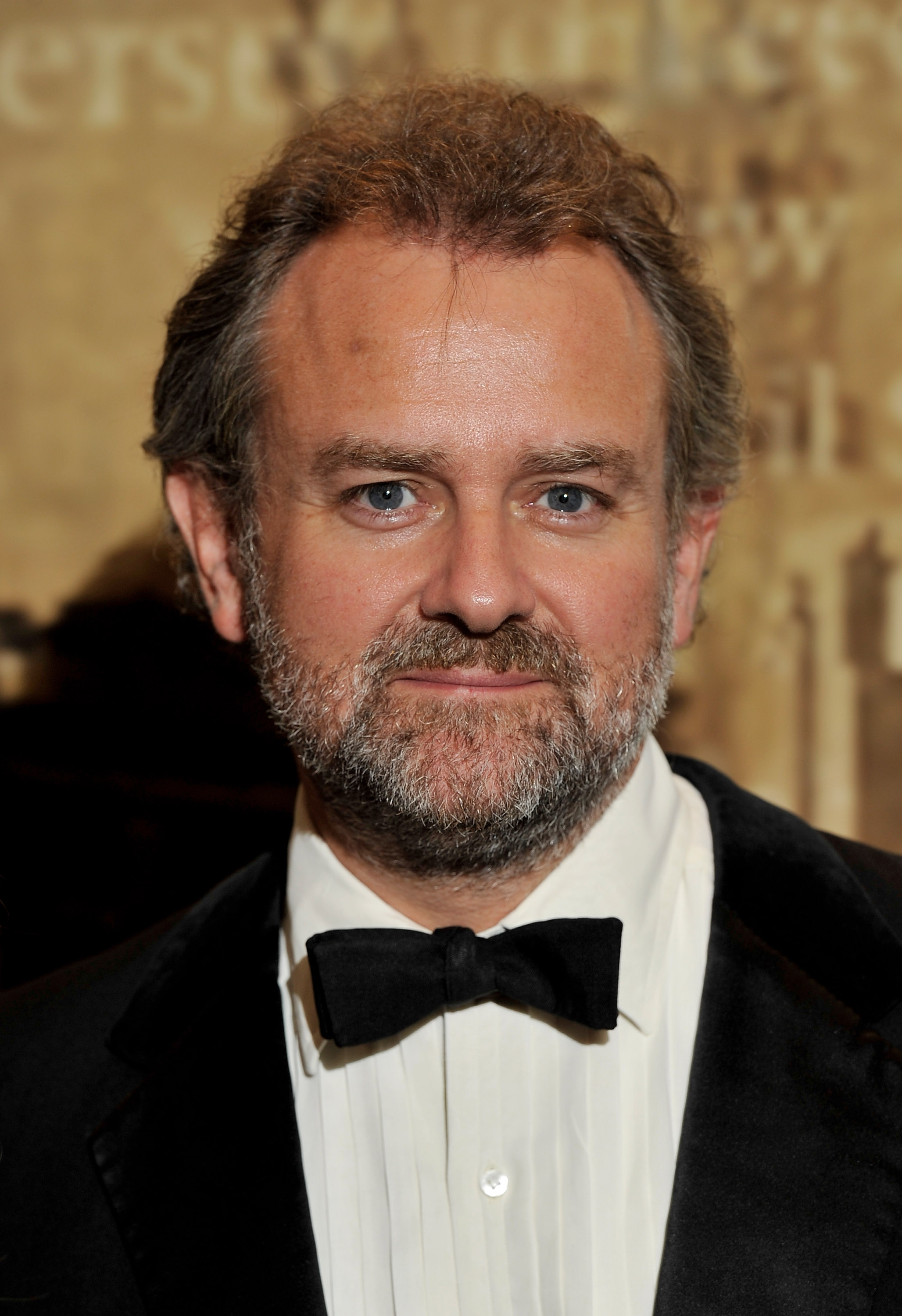 Hugh Bonneville stepped out at The Specsavers Crime Thriller Awards in 2010 with a full salt-and-pepper beard and tousled hair, embracing a more rugged, understated look that echoed the early days of his role as Lord Grantham on "Downton Abbey."