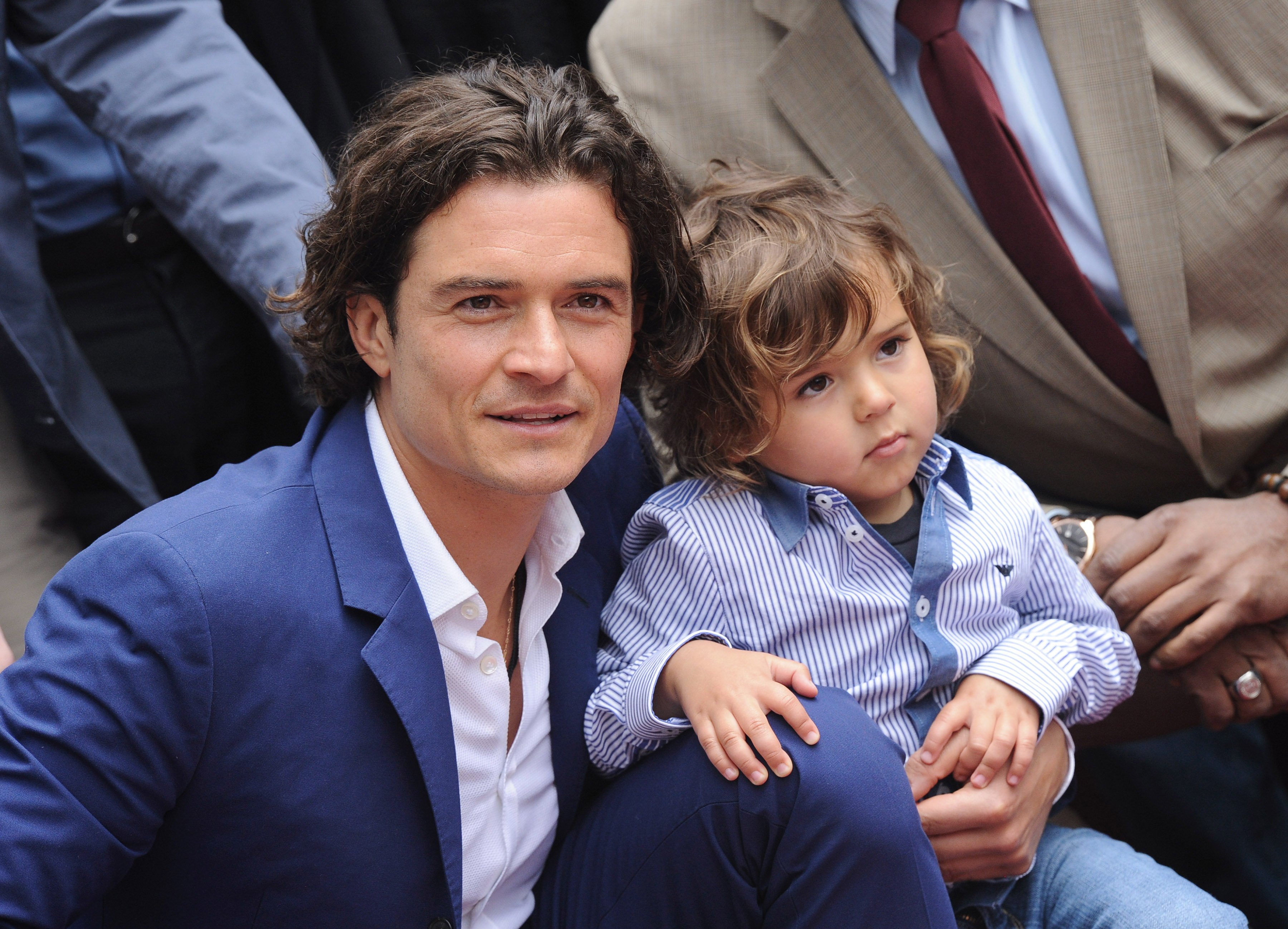 Orlando Bloom and his son Flynn attend Bloom's Hollywood Walk of Fame star honor event in California on April 2, 2014 | Photo: Getty Images