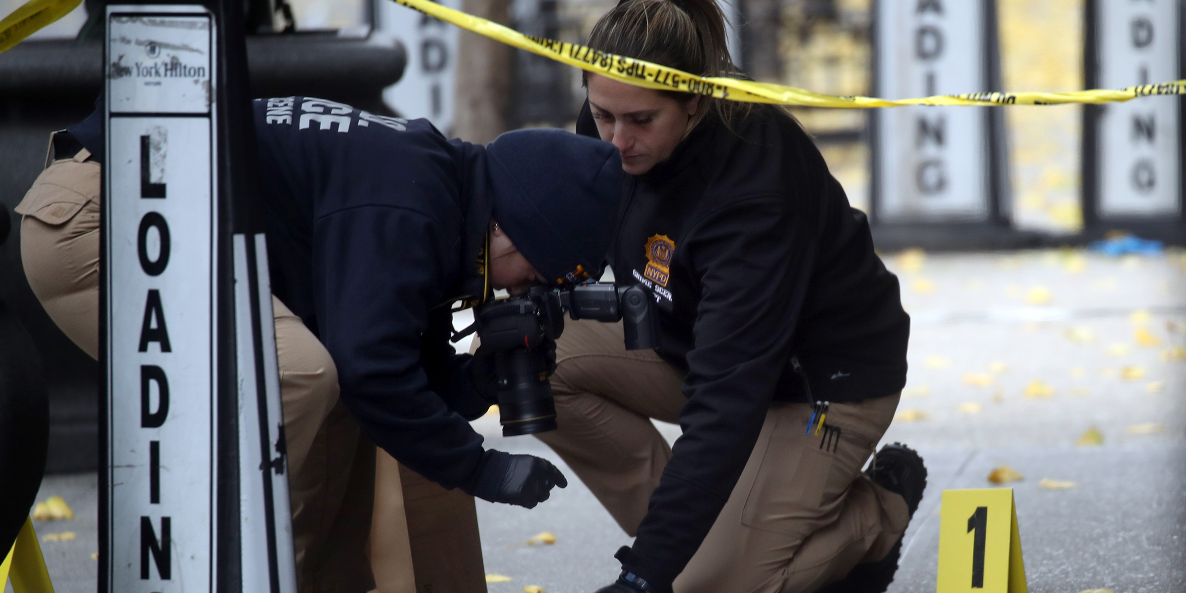 Police retrieve bullet casings | Source: Getty Images